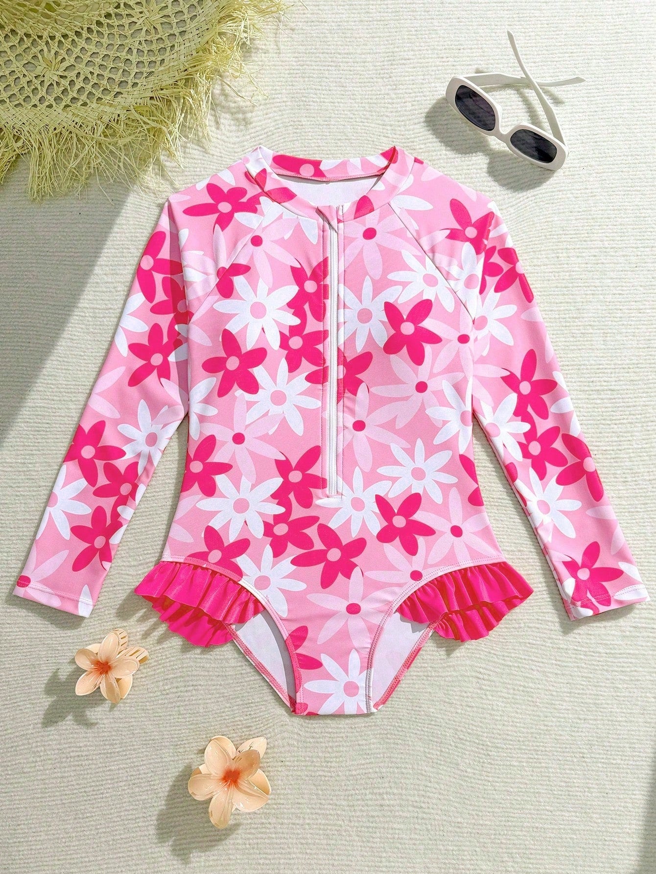 Girls' floral one-piece swimsuit with ruffle trim, high neck, and zipper front for beach and resort wear