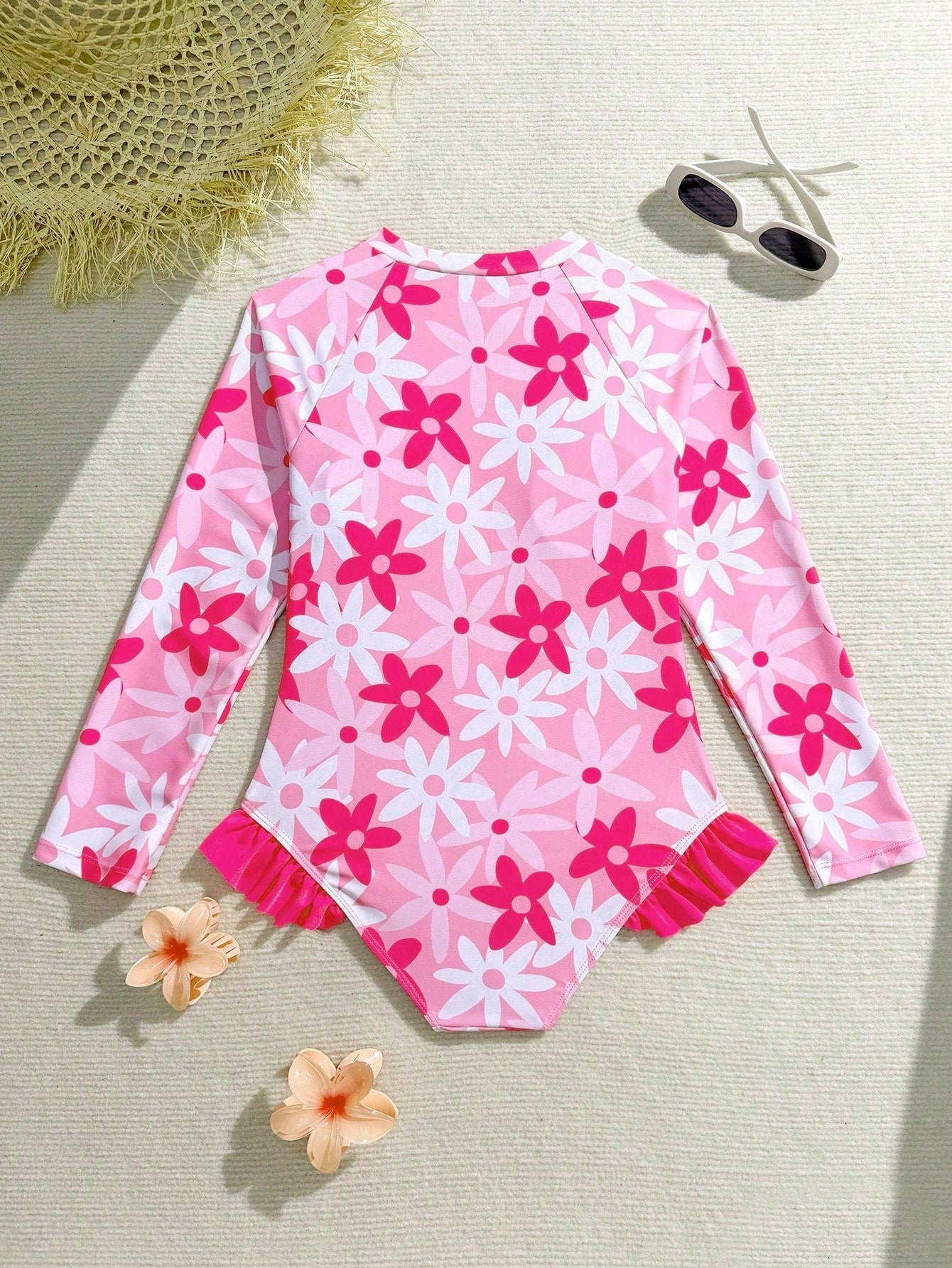 Girls' floral one-piece swimsuit with ruffle trim, high neck, and zipper front for beach and resort wear