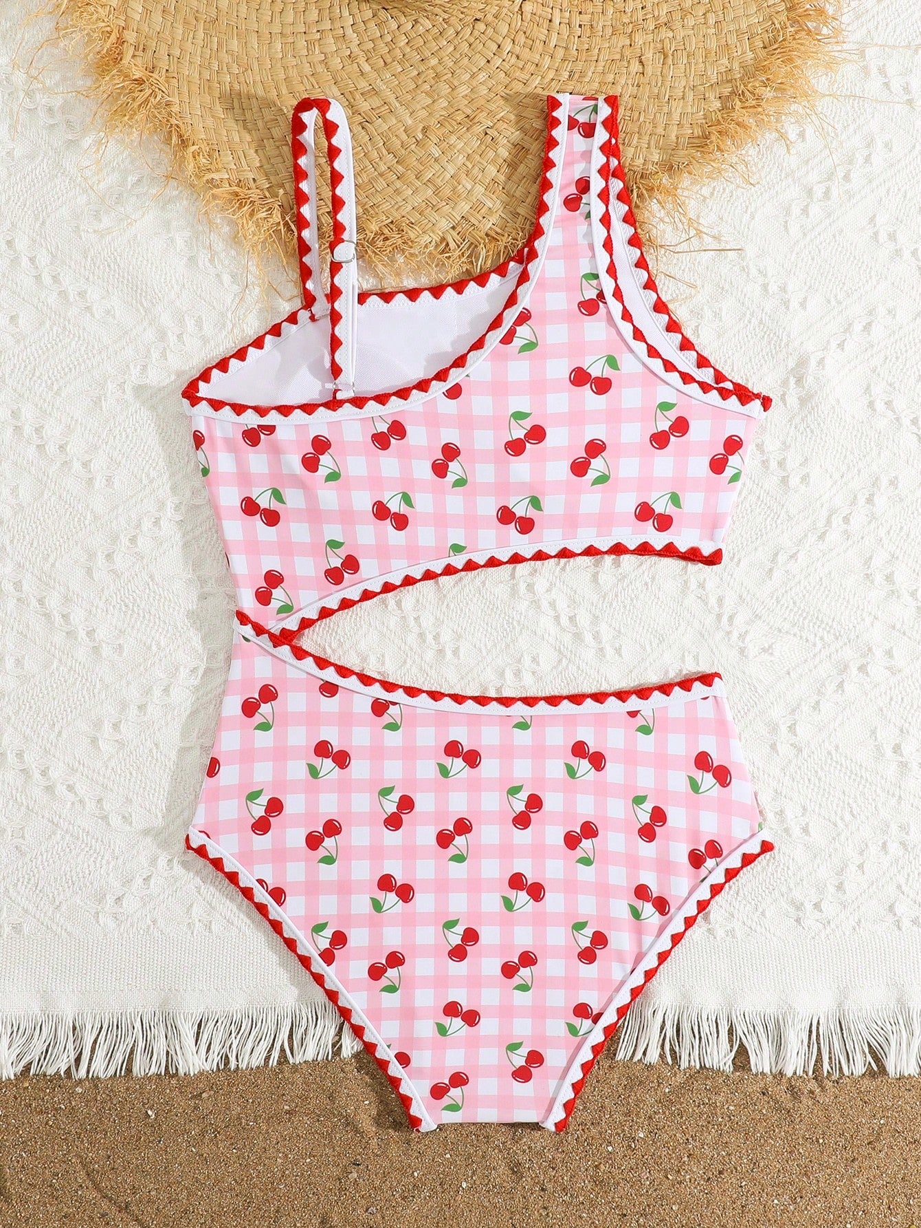 Tween girls one-piece swimsuit featuring an asymmetric neckline, pendant decor, plain design, wireless bra, high-cut bottom, and medium-stretch fabric.