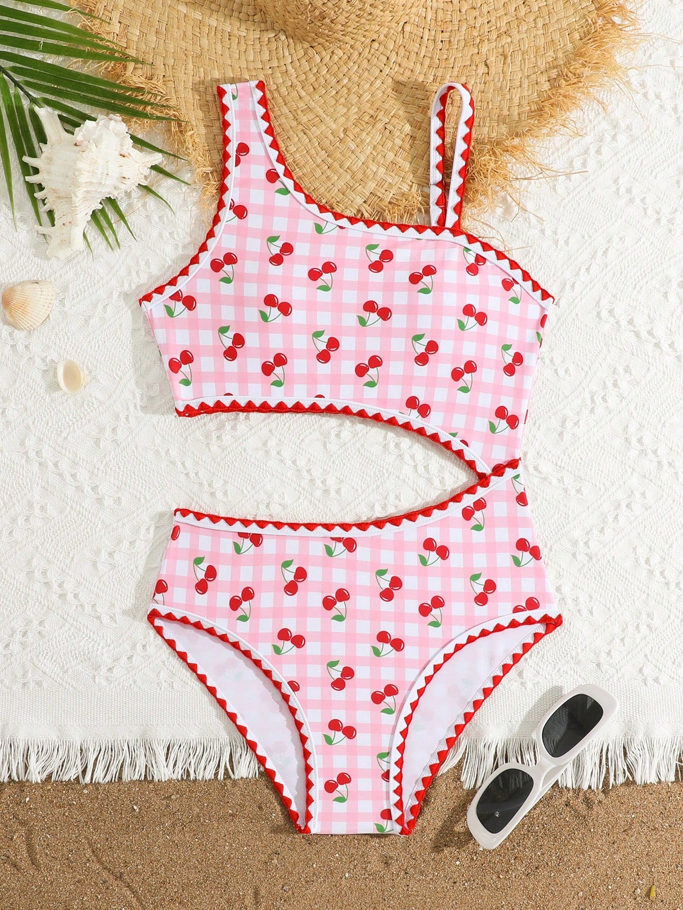 Tween girls one-piece swimsuit featuring an asymmetric neckline, pendant decor, plain design, wireless bra, high-cut bottom, and medium-stretch fabric.