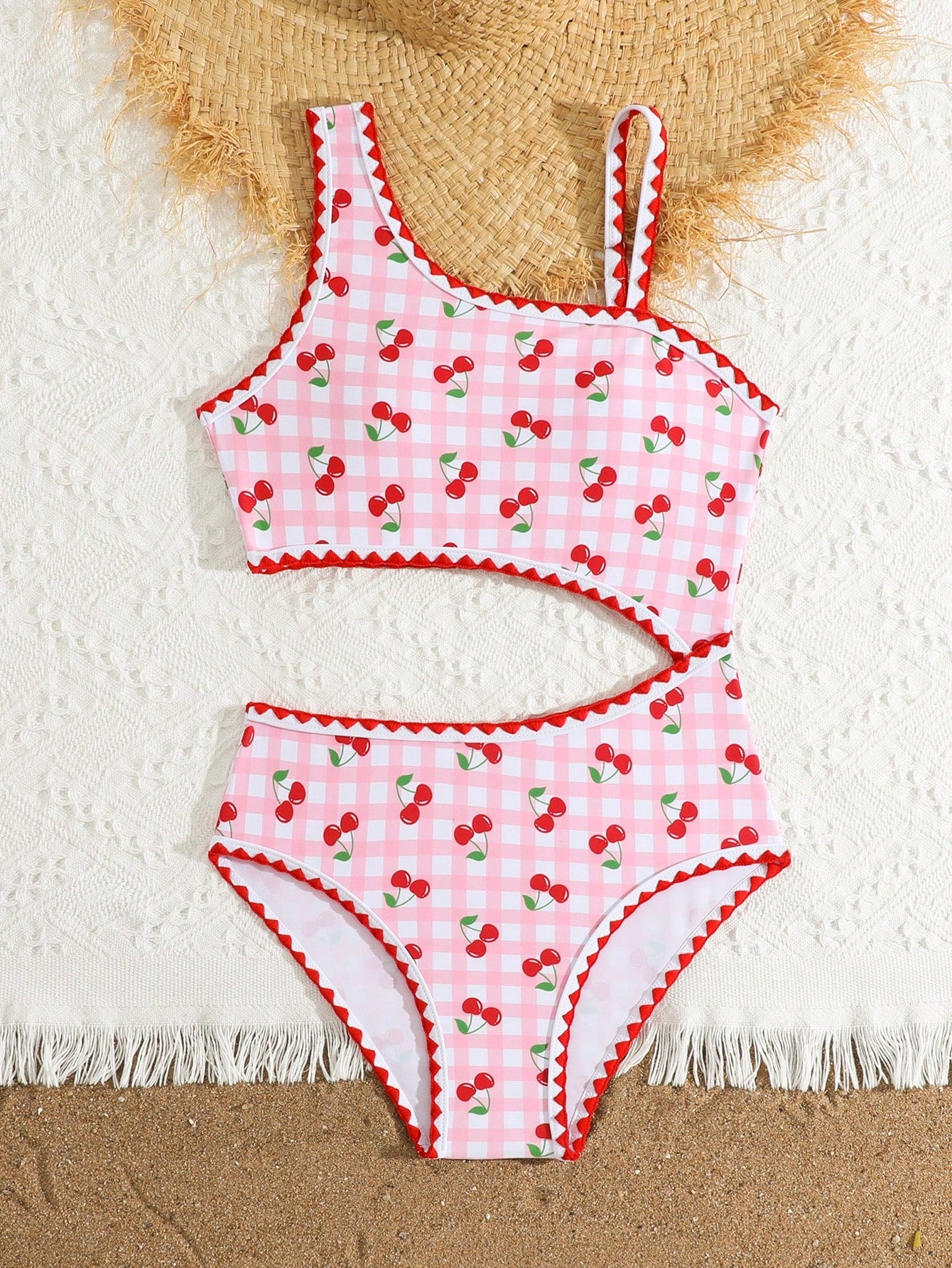 Tween girls one-piece swimsuit featuring an asymmetric neckline, pendant decor, plain design, wireless bra, high-cut bottom, and medium-stretch fabric.