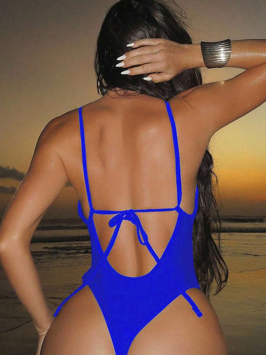 Women's black lace one-piece swimsuit featuring a deep V-neckline, spaghetti straps, backless tie-up detail, and thong bottom.