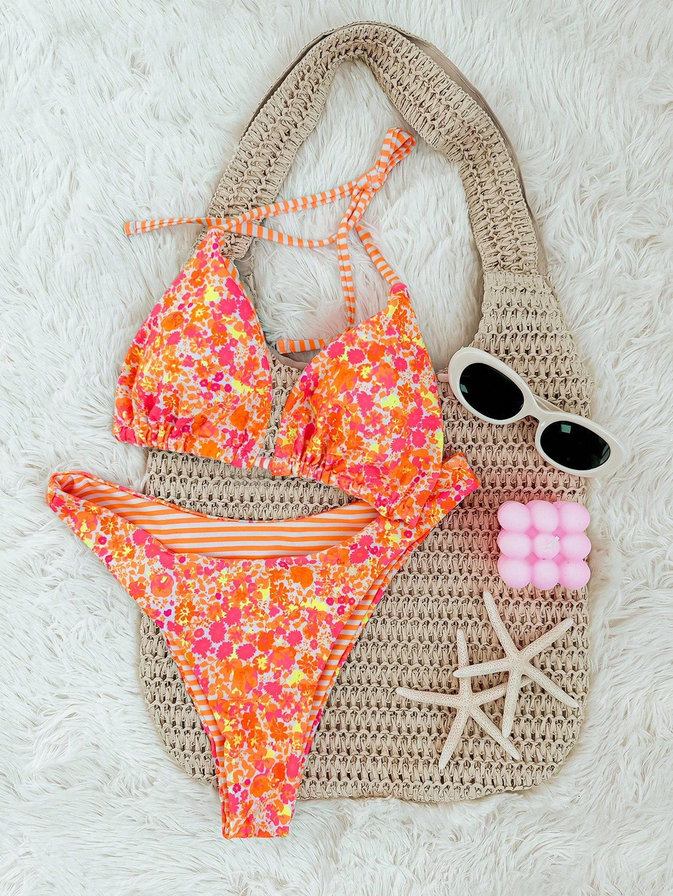 Women's two-piece halter bikini set featuring high cut thong bottoms and removable padding