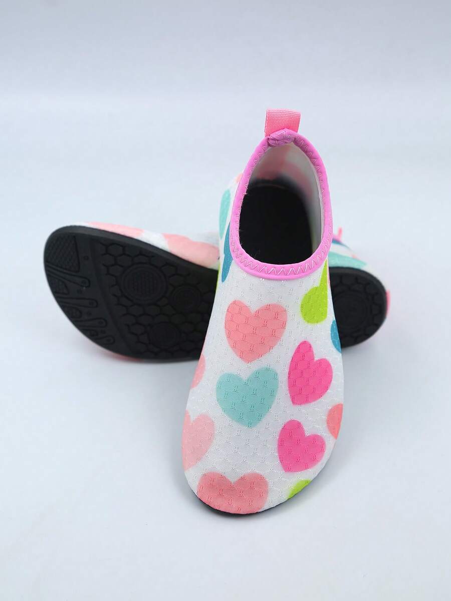Pink kids quick-dry slip-on water shoes with breathable upper and non-slip TPR outsole.