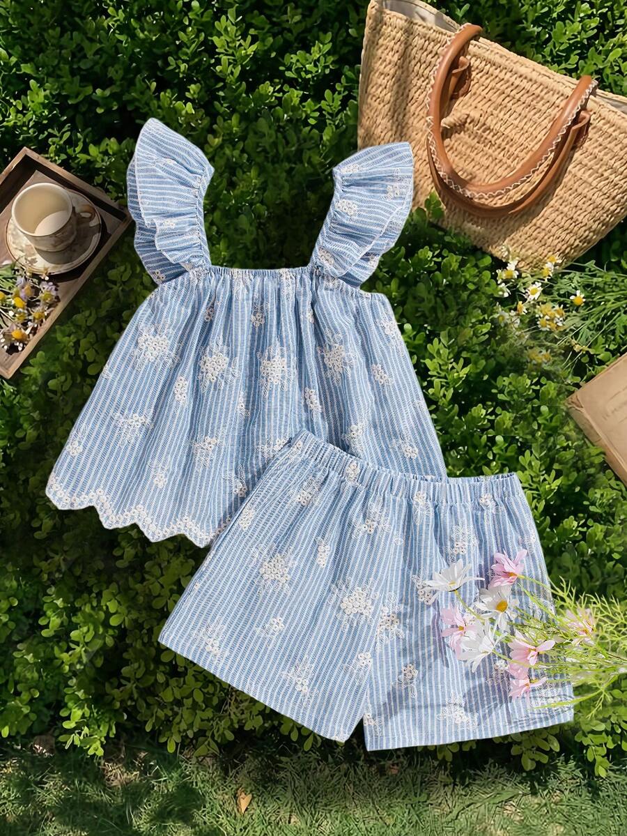 Tween girl wearing a blue and white striped sleeveless top featuring embroidery details and ruffle trim with matching shorts.