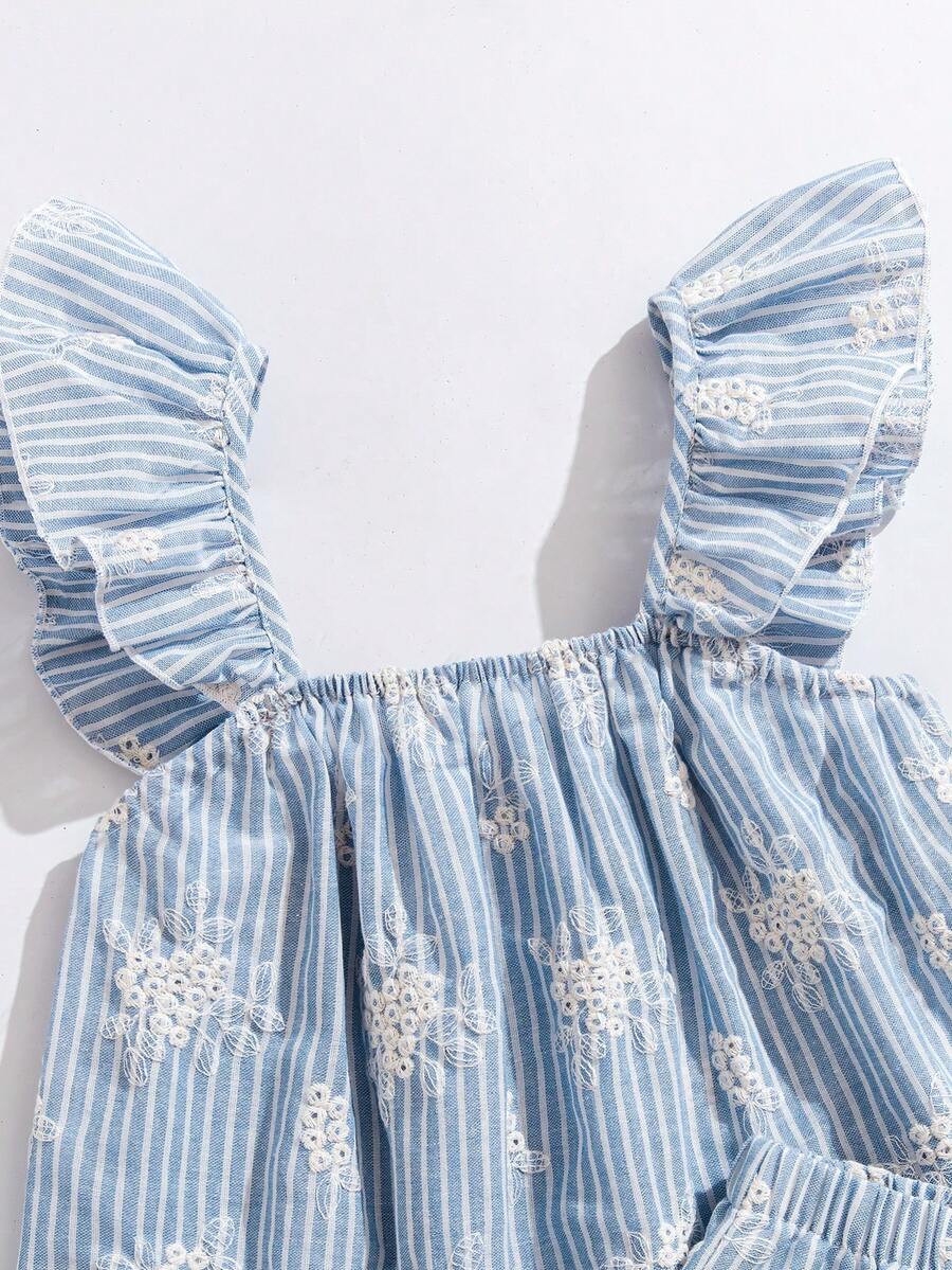Tween girl wearing a blue and white striped sleeveless top featuring embroidery details and ruffle trim with matching shorts.