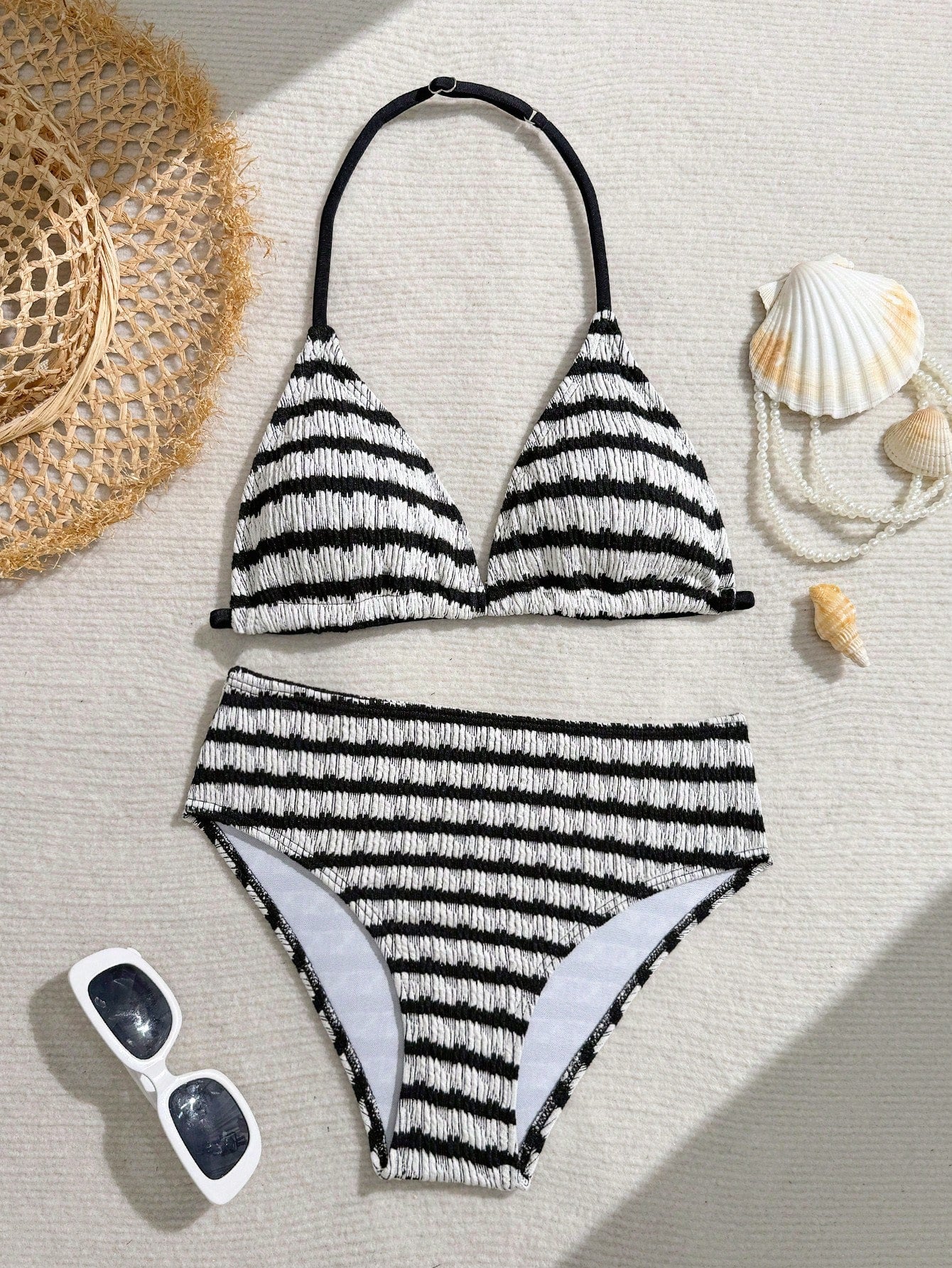 Tween girls blue and white striped two-piece bikini set with halter triangle top and mid-waist short bikini bottoms for beach and vacation swimwear.