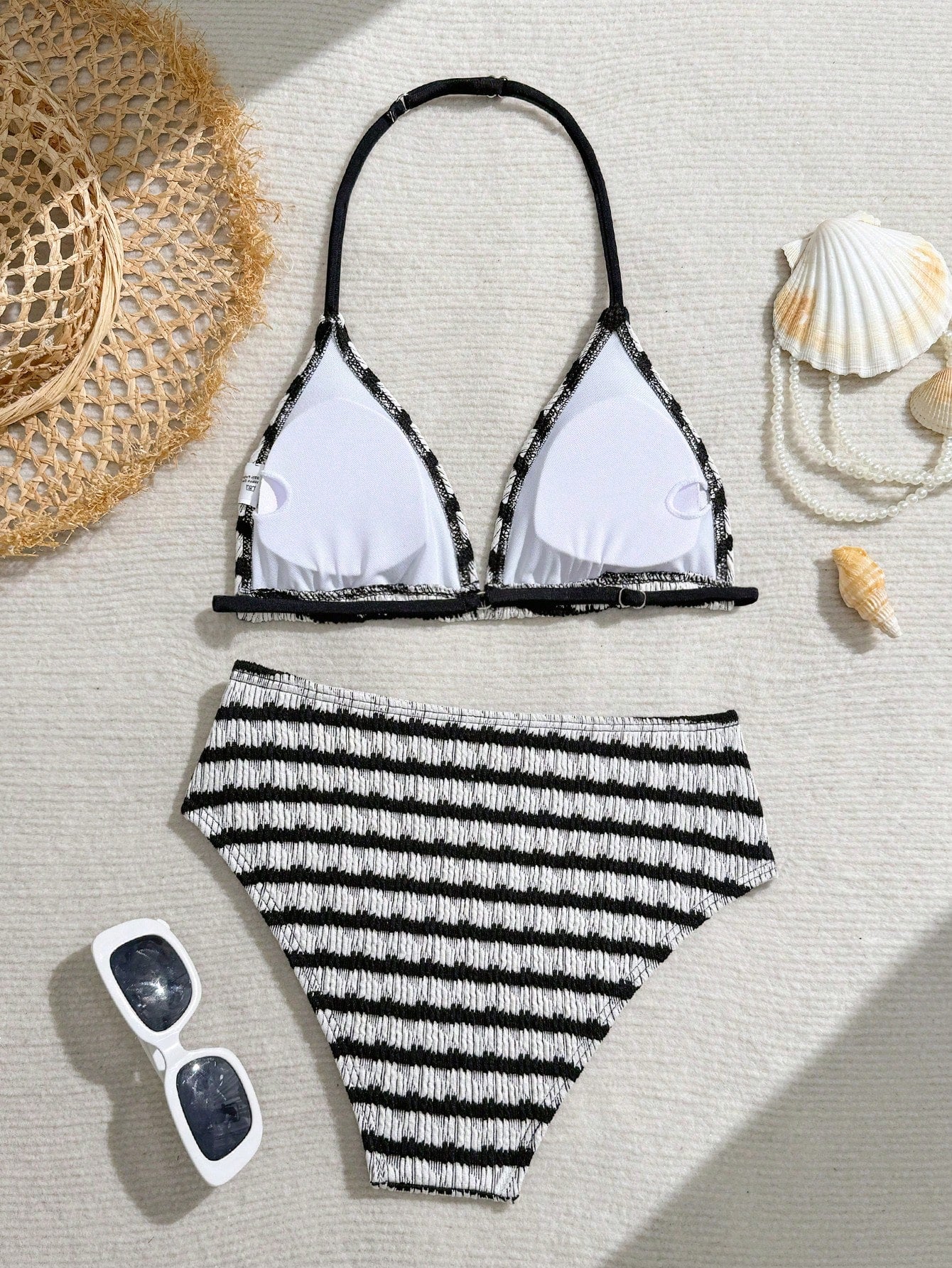 Tween girls blue and white striped two-piece bikini set with halter triangle top and mid-waist short bikini bottoms for beach and vacation swimwear.