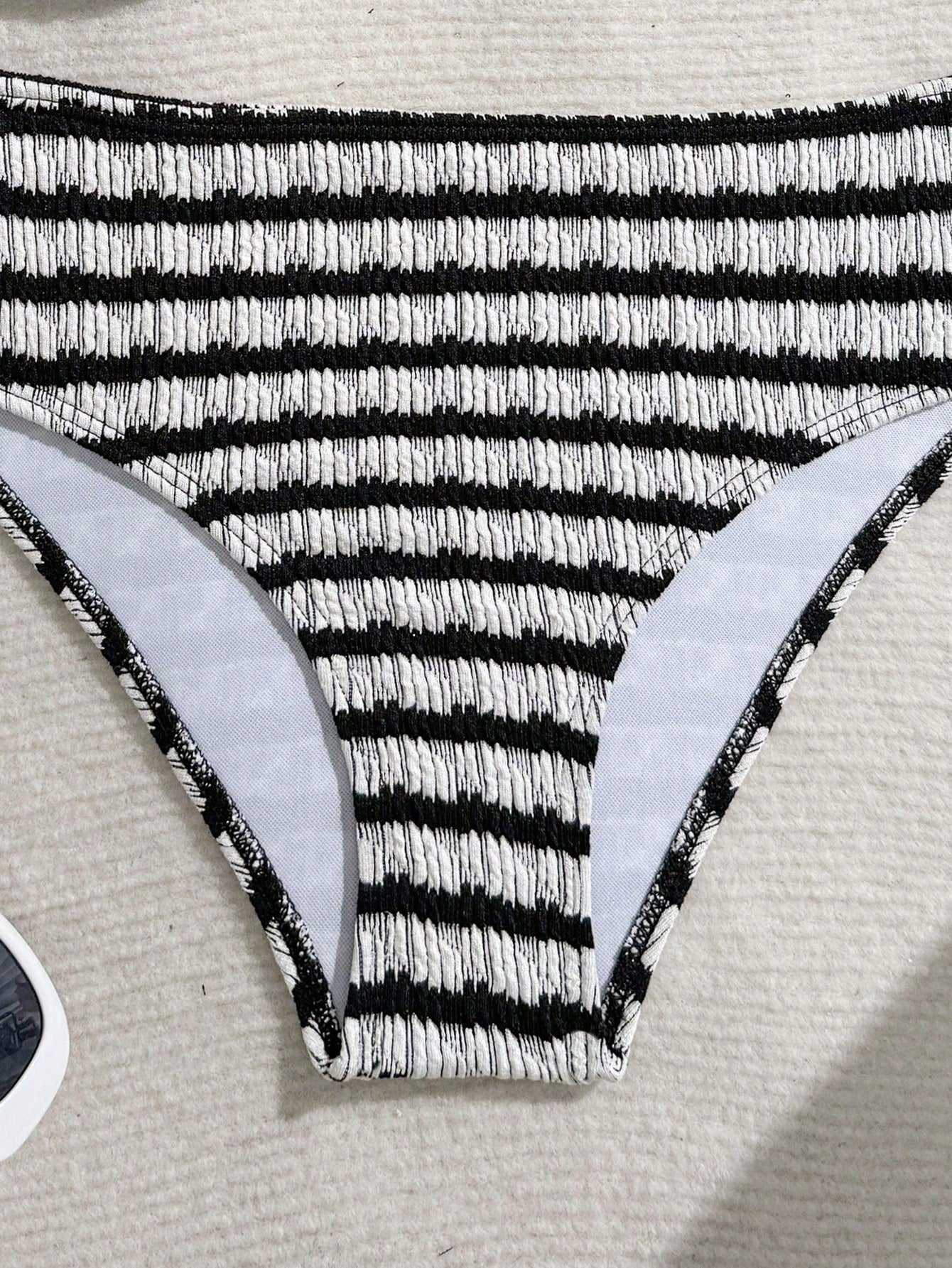 Tween girls blue and white striped two-piece bikini set with halter triangle top and mid-waist short bikini bottoms for beach and vacation swimwear.