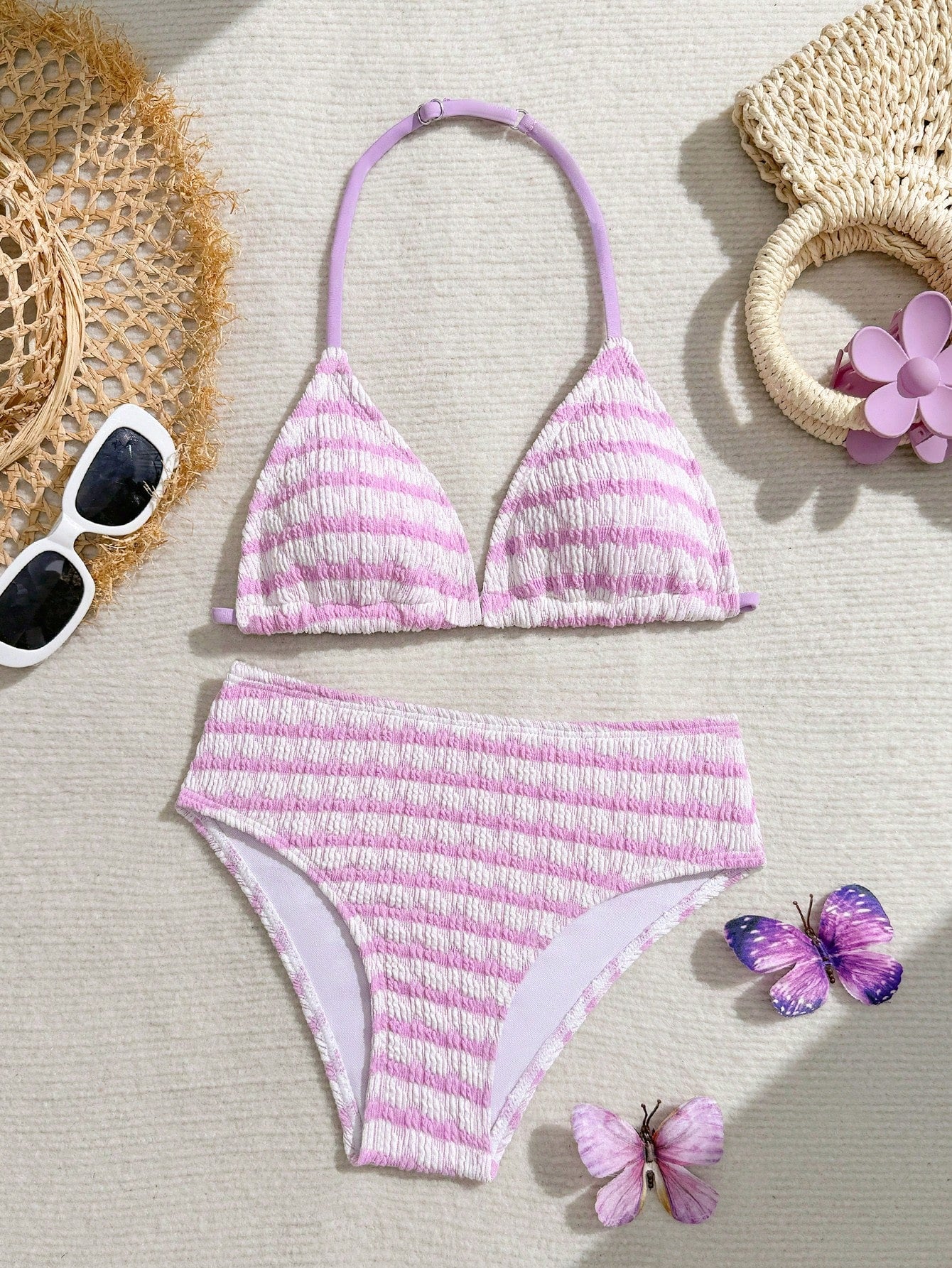 Tween girls blue and white striped two-piece bikini set with halter triangle top and mid-waist short bikini bottoms for beach and vacation swimwear.
