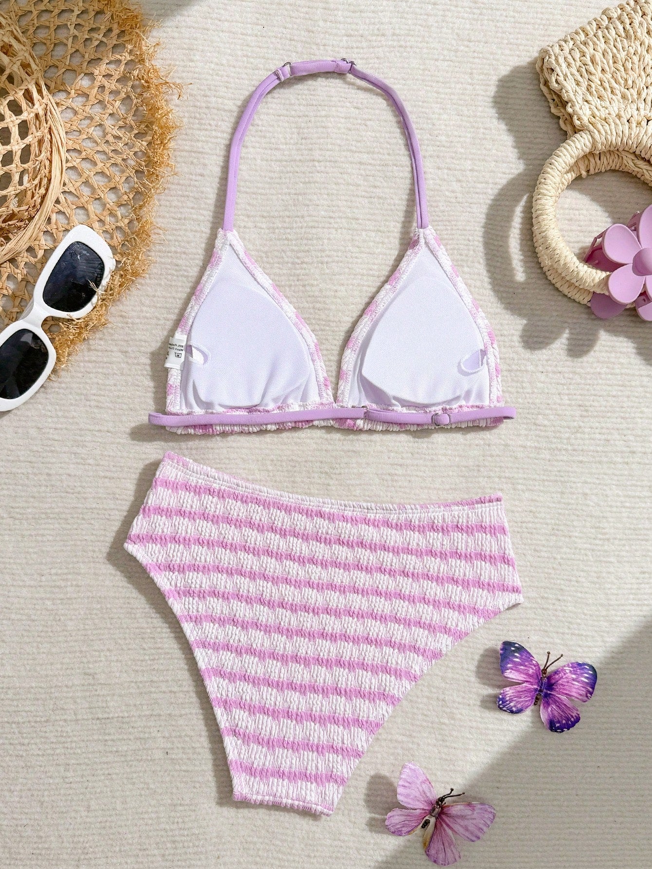Tween girls blue and white striped two-piece bikini set with halter triangle top and mid-waist short bikini bottoms for beach and vacation swimwear.