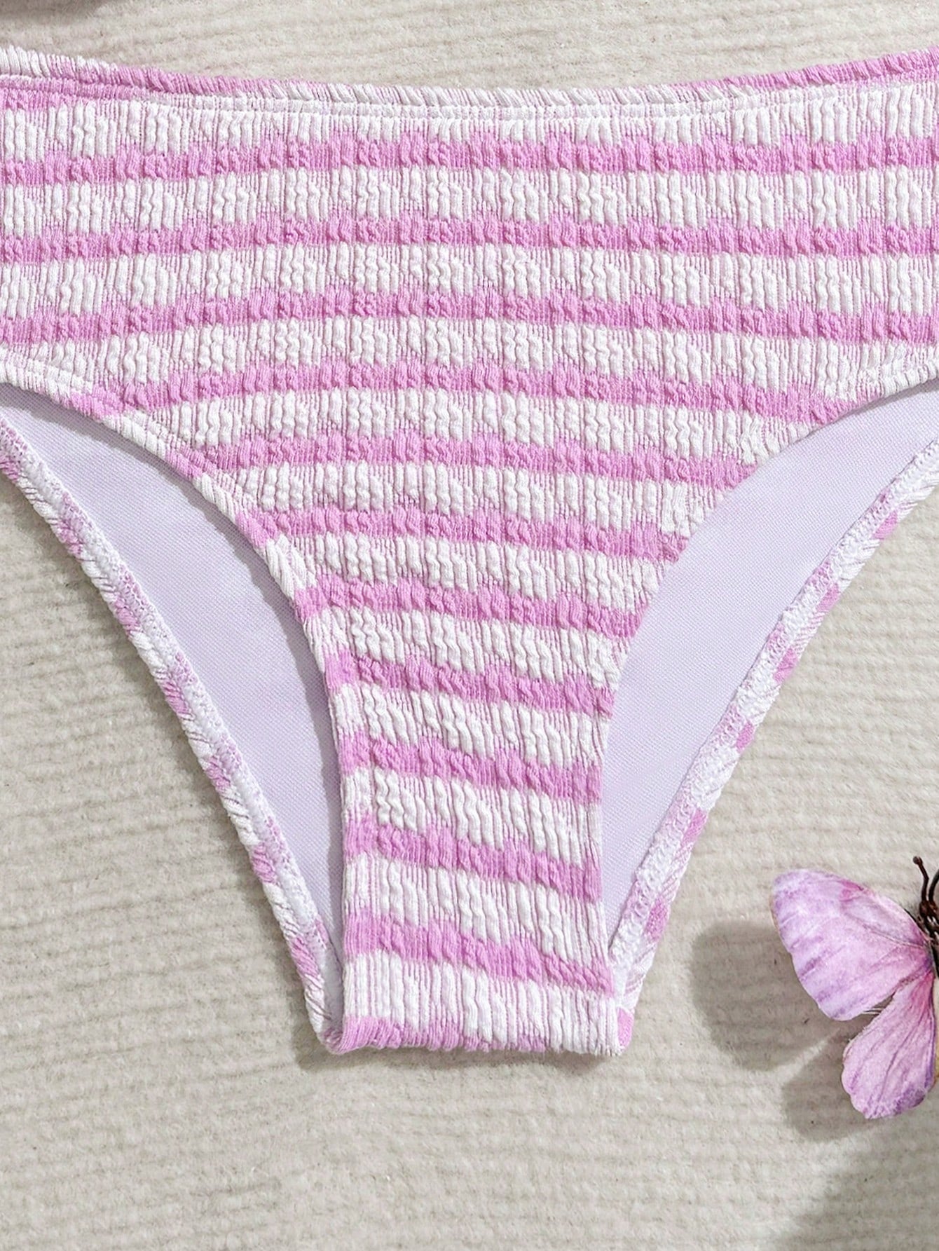 Tween girls blue and white striped two-piece bikini set with halter triangle top and mid-waist short bikini bottoms for beach and vacation swimwear.