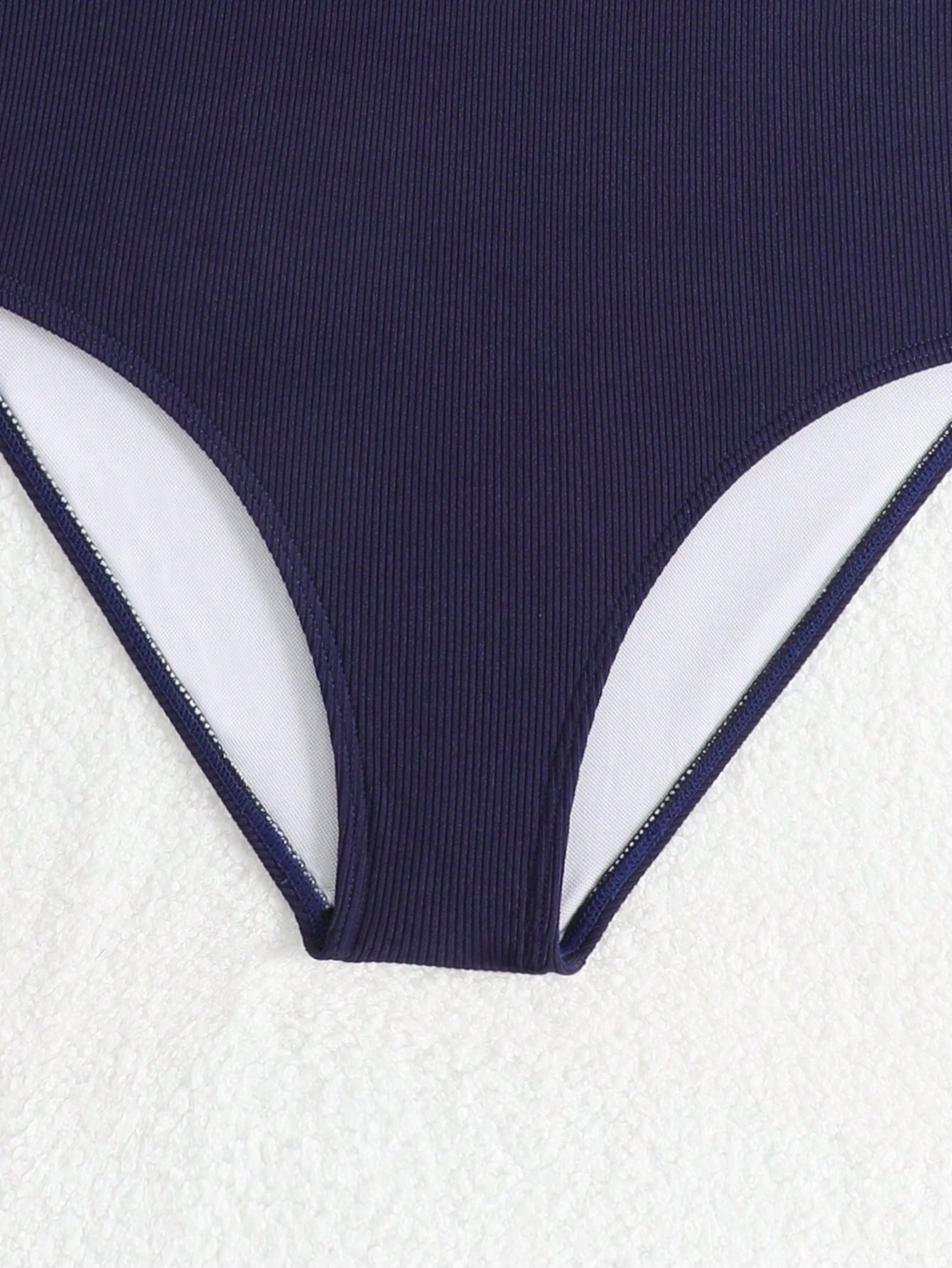 White tween girls one-piece swimsuit with V-neck, cutout detail, appliques, plant pattern, mid-waist bottom, and lined body for beach or swimming