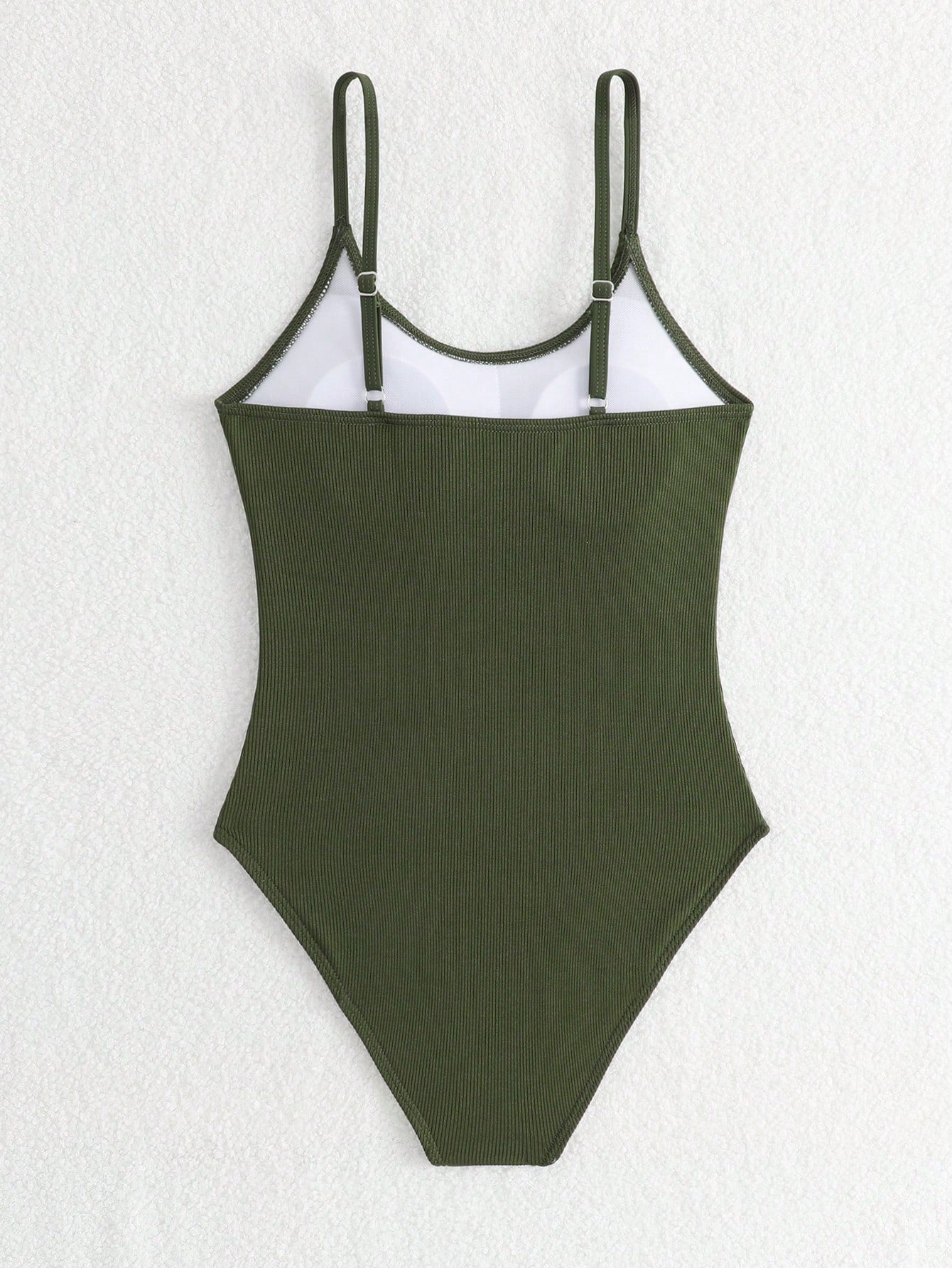 Purple rib knit one-piece swimsuit for tween girls with spaghetti straps, fitted shape, mid-waist bottom, wireless bra, and lined body.