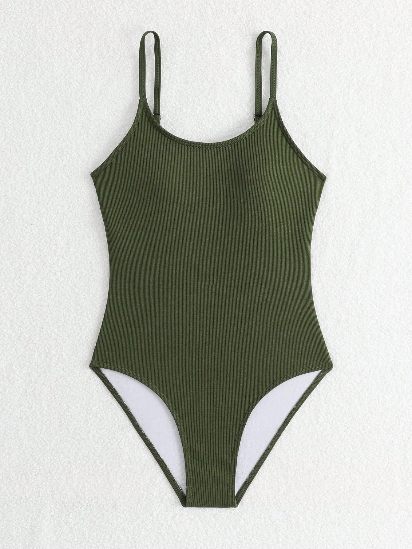 Purple rib knit one-piece swimsuit for tween girls with spaghetti straps, fitted shape, mid-waist bottom, wireless bra, and lined body.
