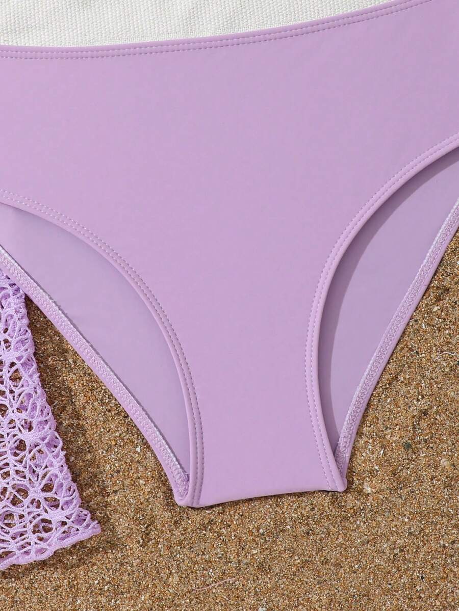 Tween girls beige bikini set with long sleeve round neck top, hollow-out asymmetrical details, mid-waist bottoms, and cover up for beach or vacation swimwear
