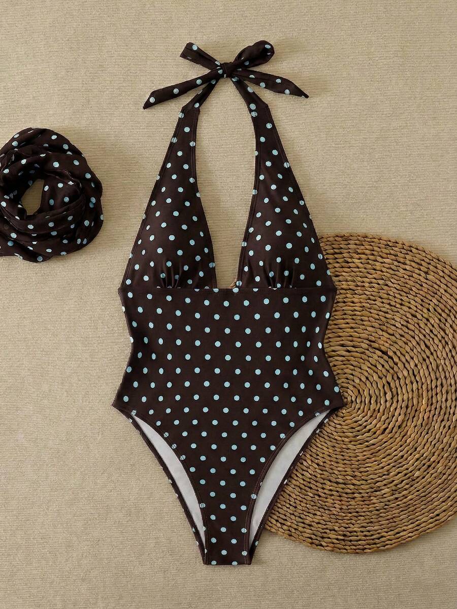 Women's apricot polka dot two-piece swimsuit featuring an asymmetrical halter backless top with knot tie detail and high-waisted bottoms.