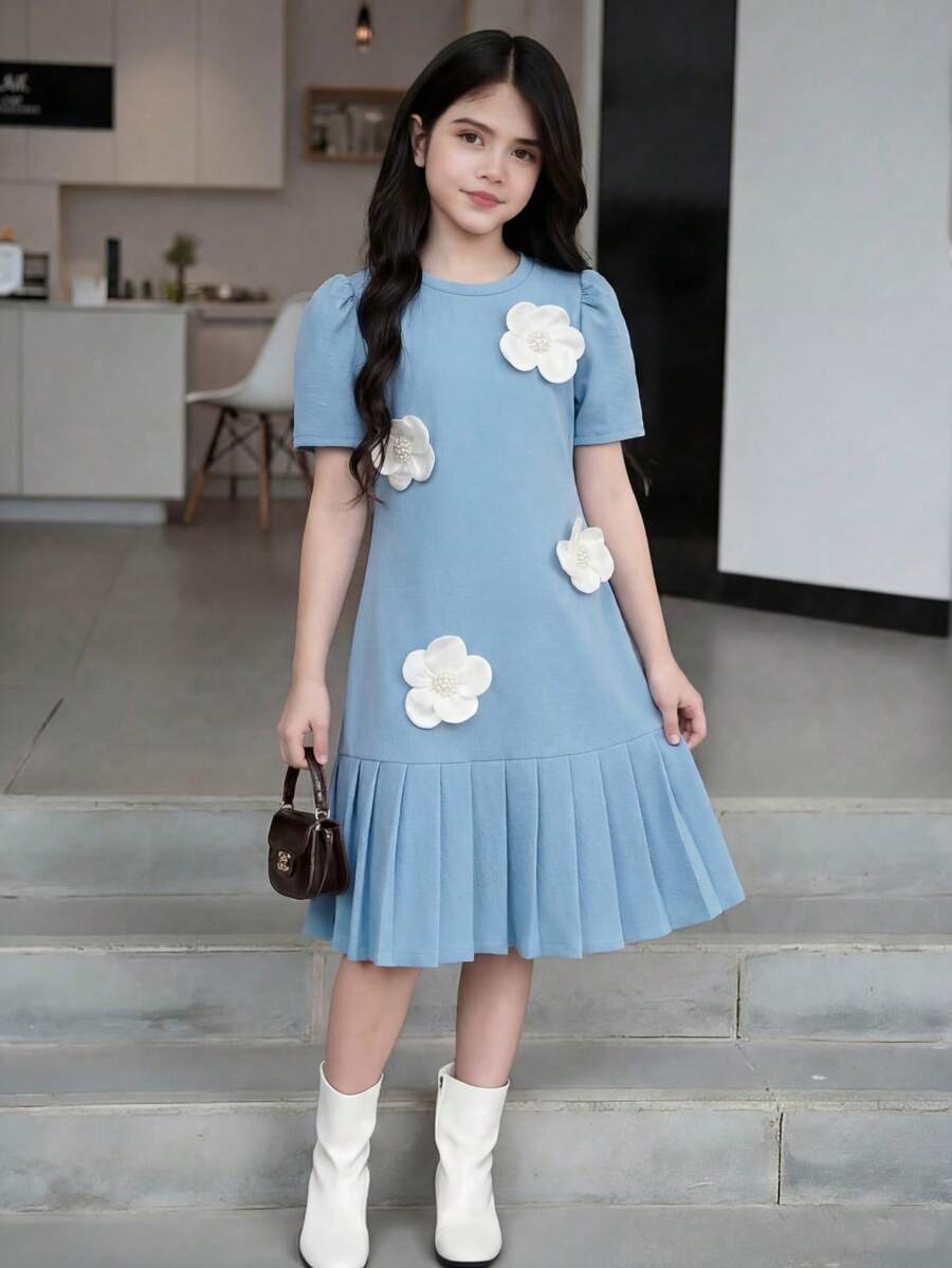 Tween girls apricot short-sleeve pleated smock dress with 3D bow decor and round neckline.