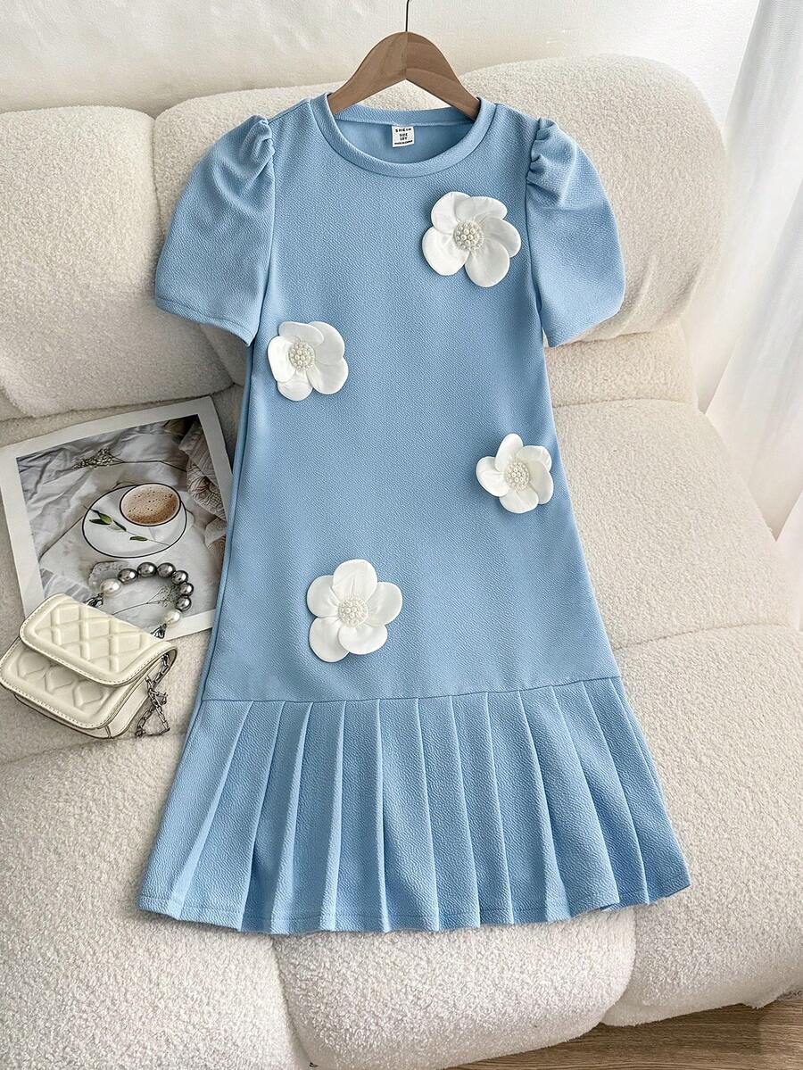 Tween girls apricot short-sleeve pleated smock dress with 3D bow decor and round neckline.