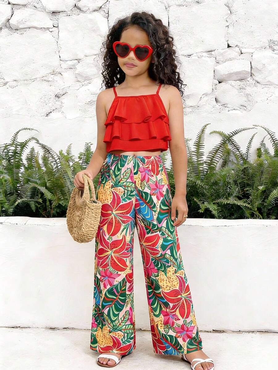 Tween girls blue 2-piece vacation outfit set featuring a tiered ruffle spaghetti strap camisole and loose high-waist pants.