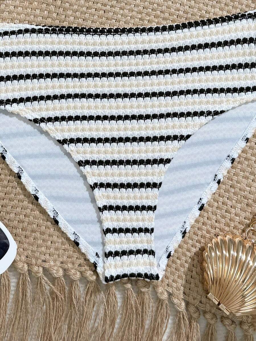 Tween girls pink and white striped two-piece bikini set with spaghetti strap bandeau top, starfish decor, and high waist swim bottoms for beach and vacation wear