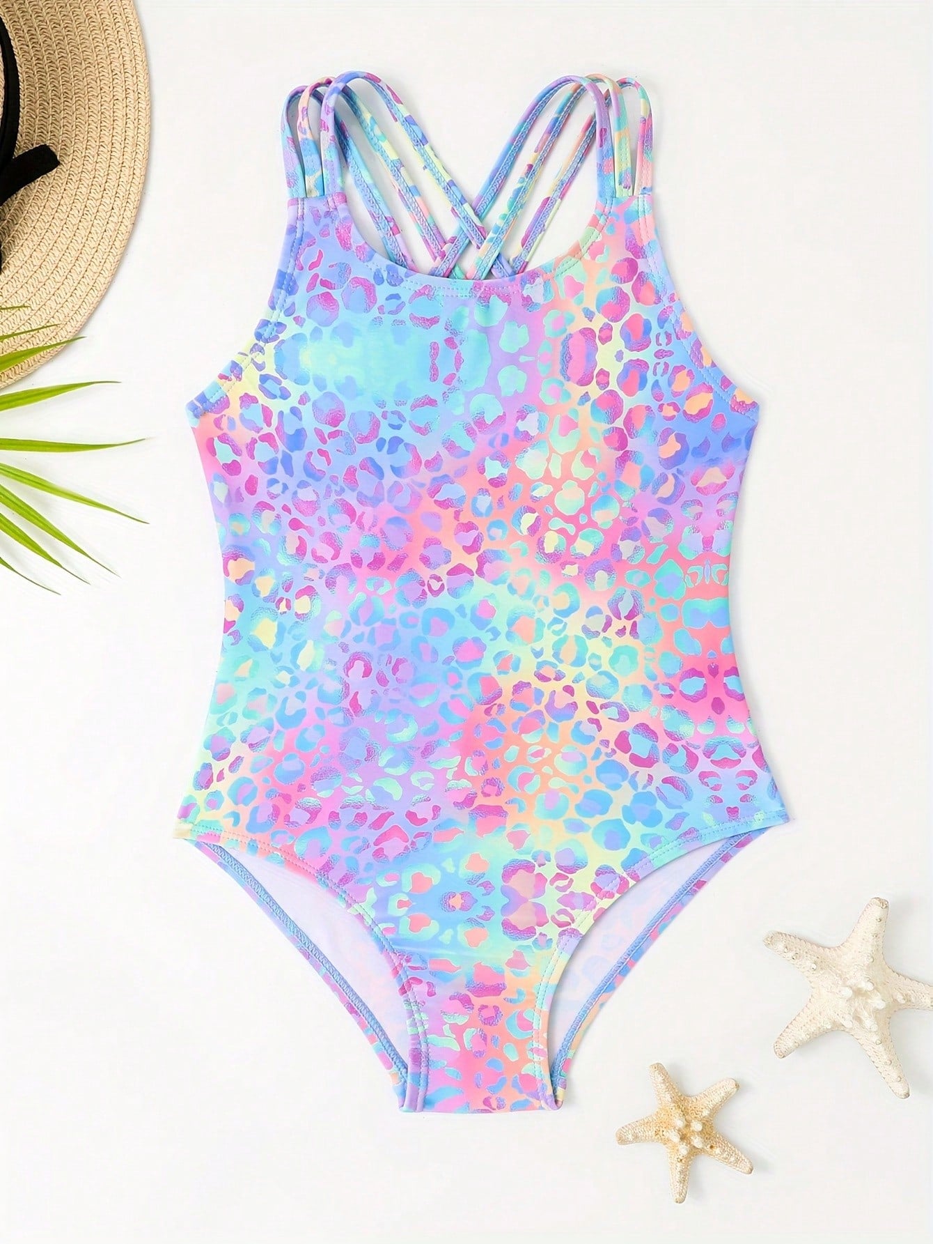 Girls' multicolor ombre leopard print one-piece swimsuit with scoop neck, ruffle detail, and criss-cross back design for summer pool wear.