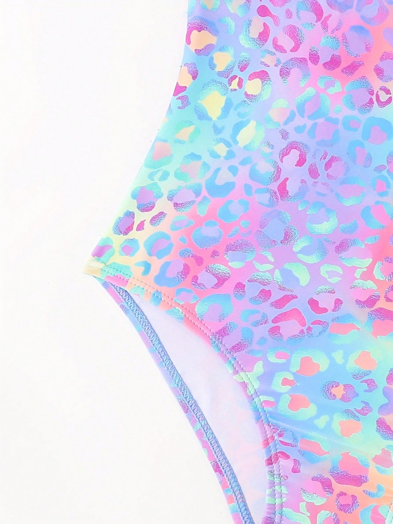 Girls' multicolor ombre leopard print one-piece swimsuit with scoop neck, ruffle detail, and criss-cross back design for summer pool wear.