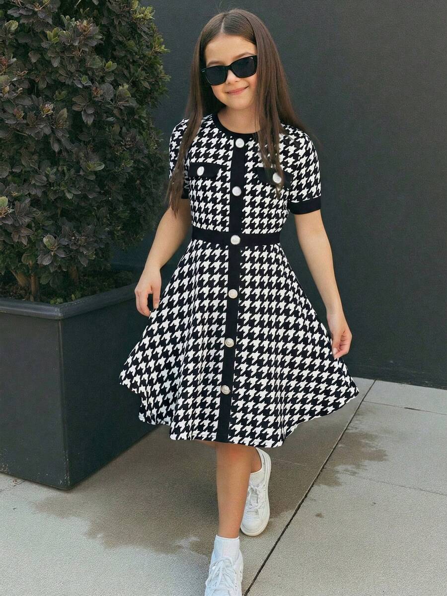 Nova Glow tween girls black and white houndstooth print short sleeve A-line dress with decorative buttons and crew neckline.