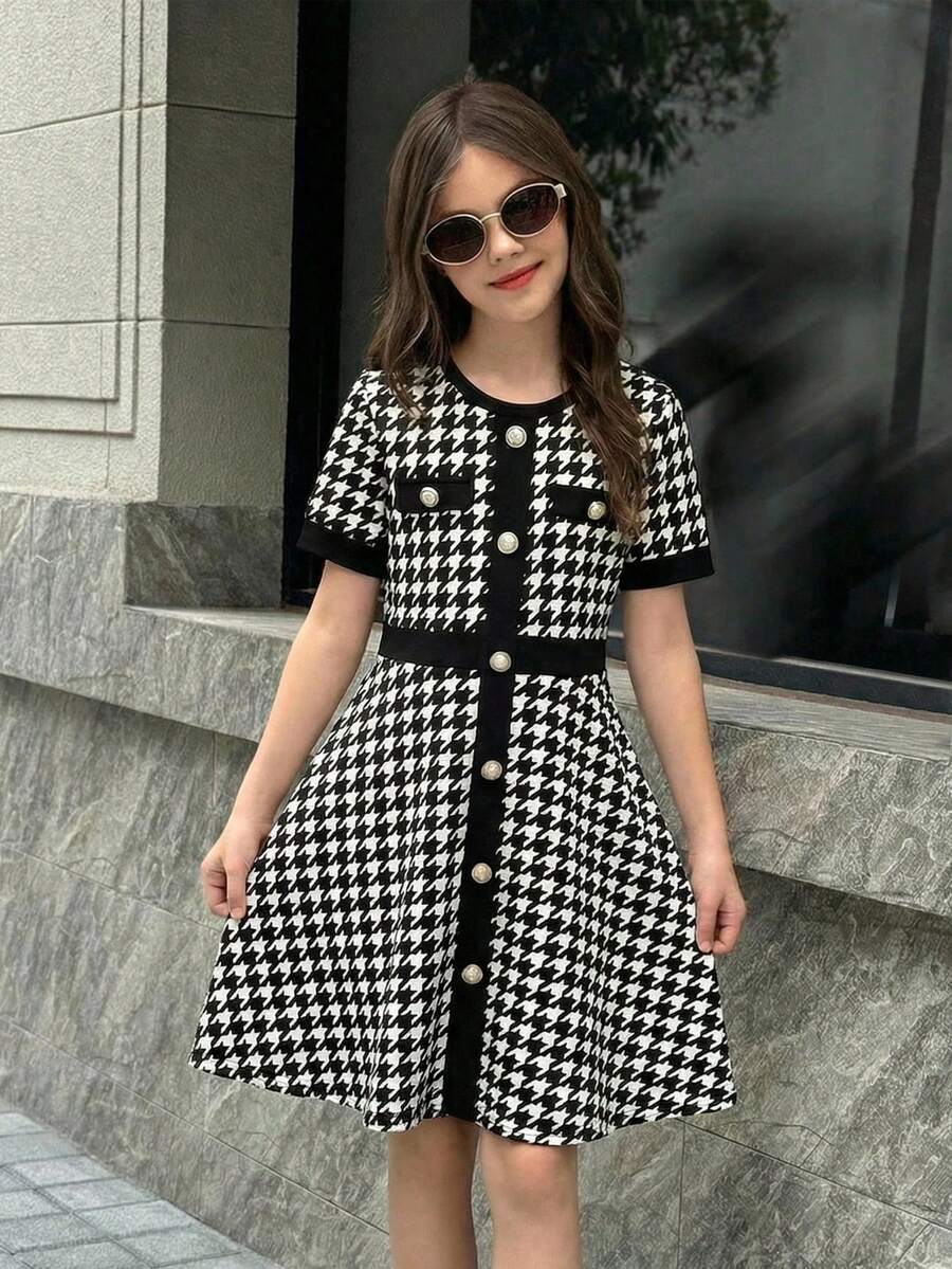 Nova Glow tween girls black and white houndstooth print short sleeve A-line dress with decorative buttons and crew neckline.