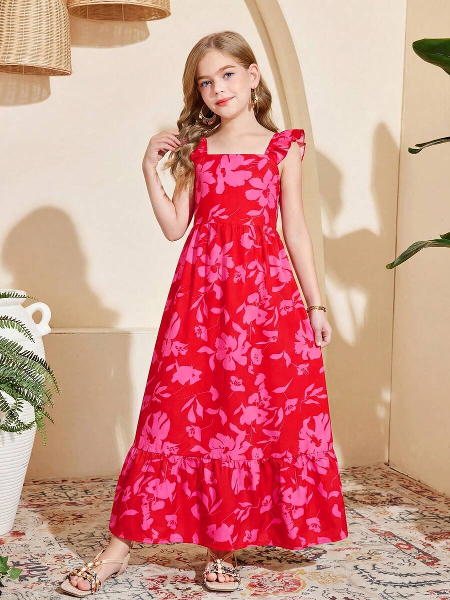 Blue floral print long vacation dress for tween girls featuring an A-line high waist silhouette with ruffle details and spaghetti straps.