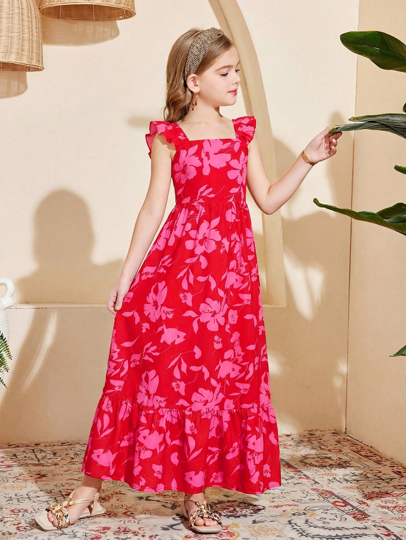 Tween girl multicolor floral vacation dress with square neck, ruffle details, shirred bodice, sleeveless A-line shape, high waist, and flounce hem.