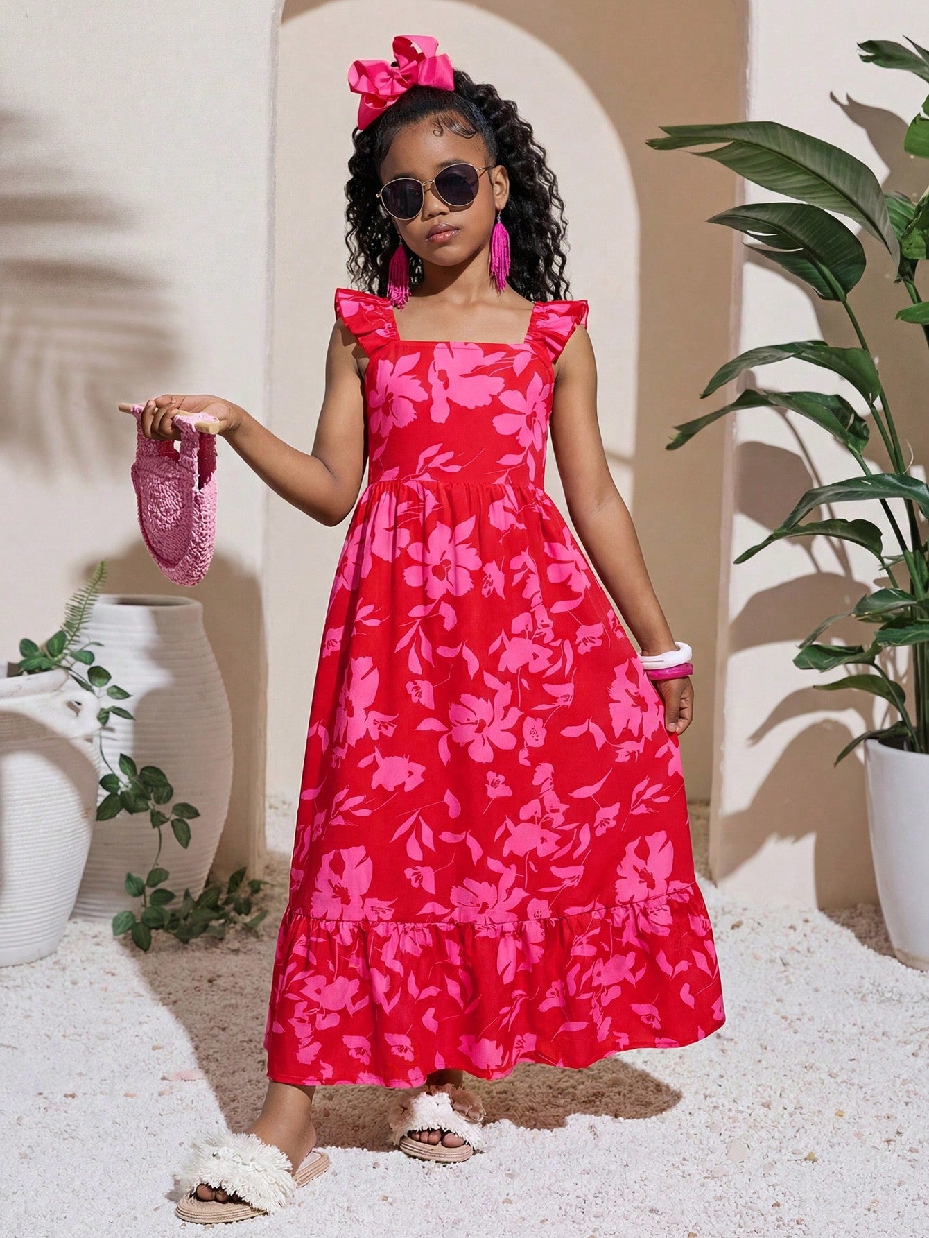 Tween girl multicolor floral vacation dress with square neck, ruffle details, shirred bodice, sleeveless A-line shape, high waist, and flounce hem.