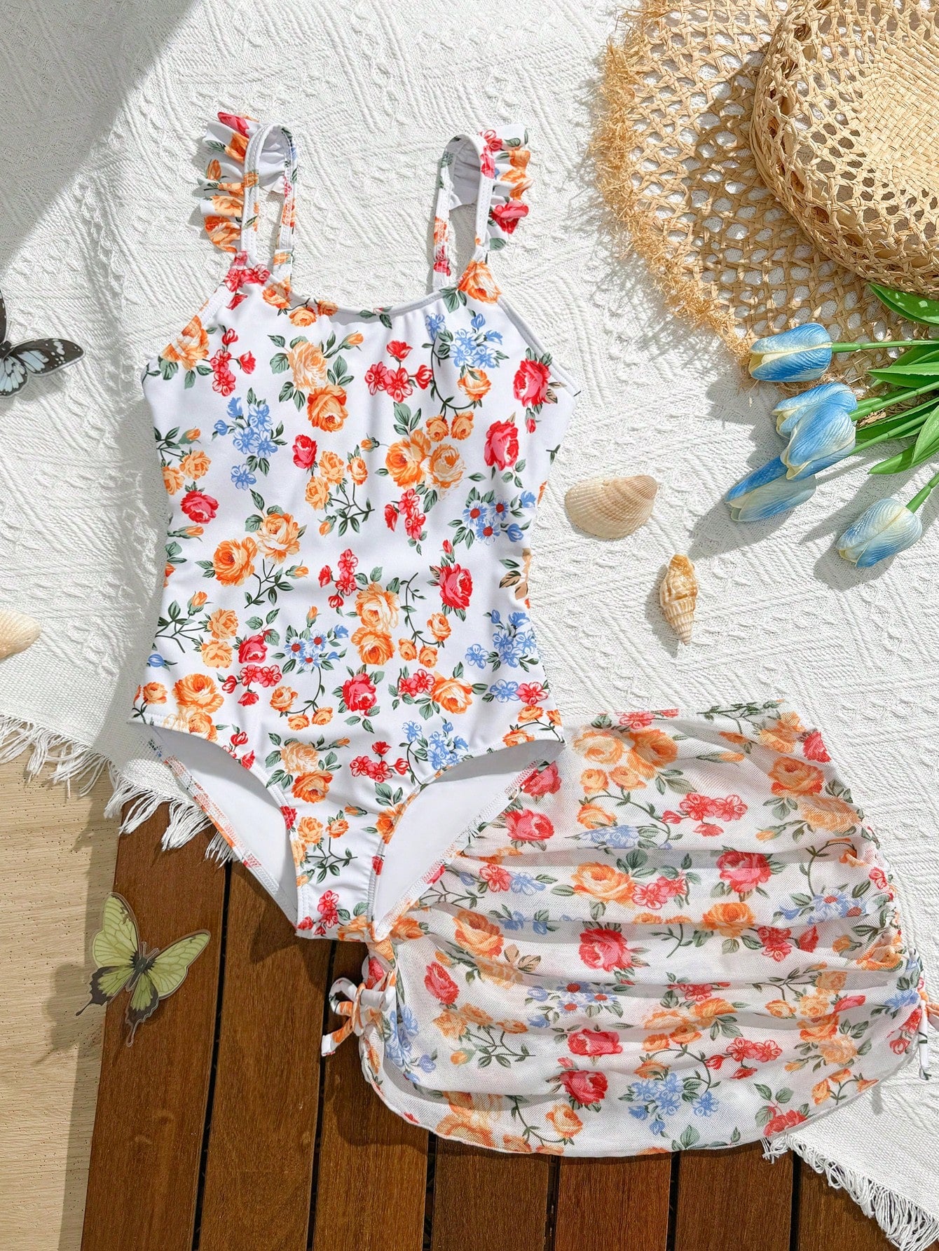 Tween girls multicolor one piece swimsuit set with spaghetti straps, ruffle detail, animal marine life print, and matching mesh cover skirt for summer vacation swimwear.