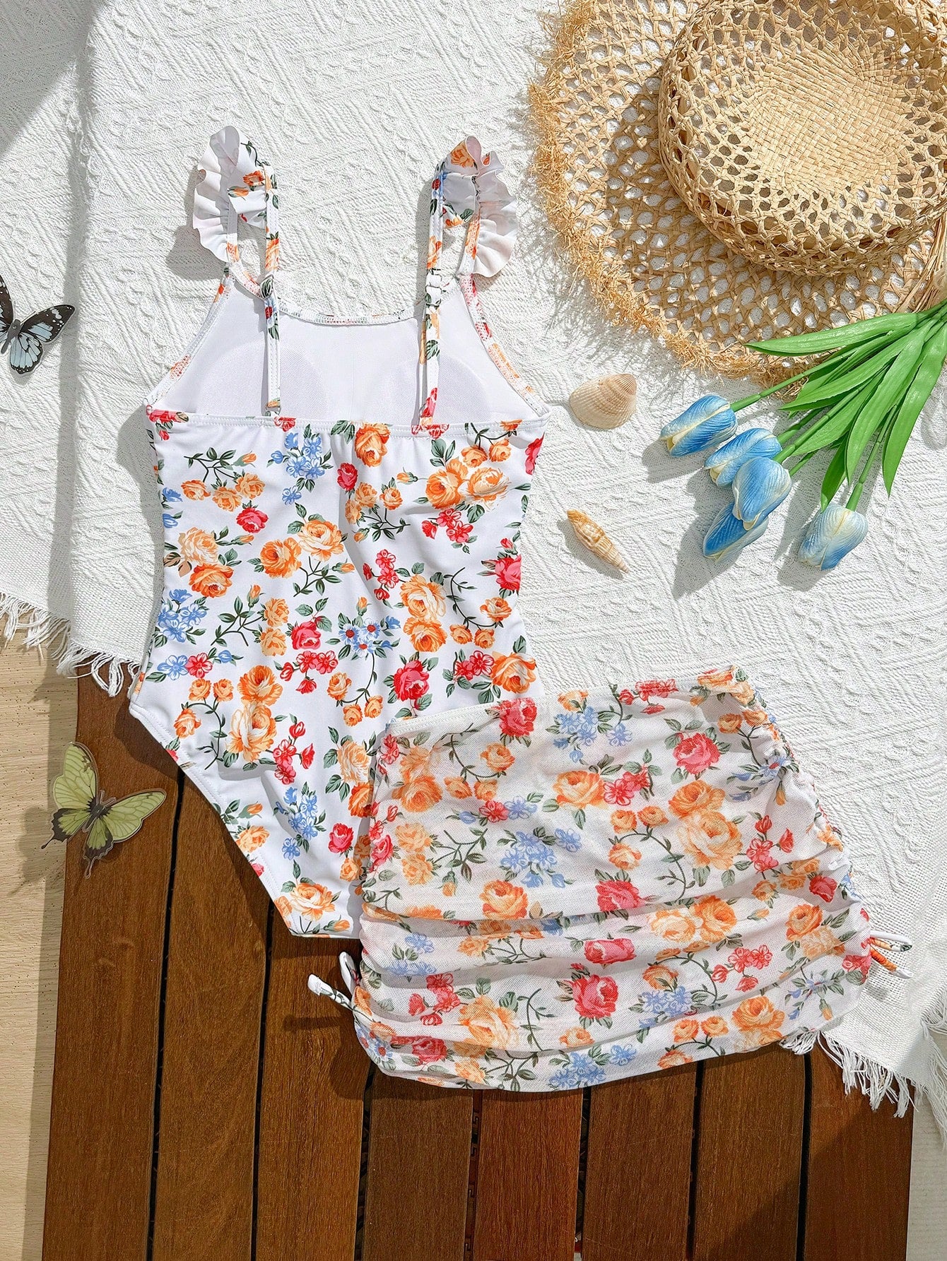 Tween girls multicolor one piece swimsuit set with spaghetti straps, ruffle detail, animal marine life print, and matching mesh cover skirt for summer vacation swimwear.