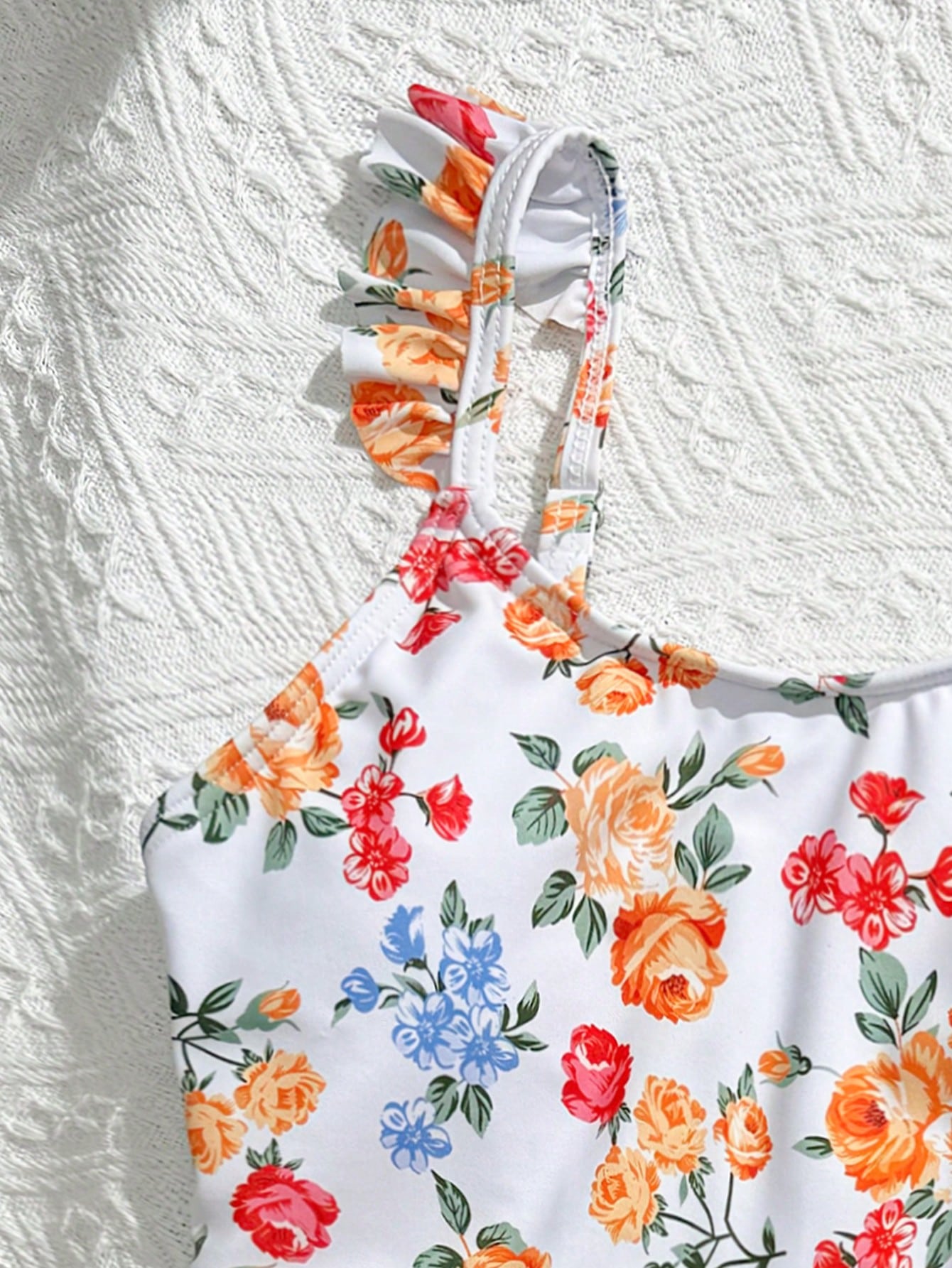 Tween girls multicolor one piece swimsuit set with spaghetti straps, ruffle detail, animal marine life print, and matching mesh cover skirt for summer vacation swimwear.