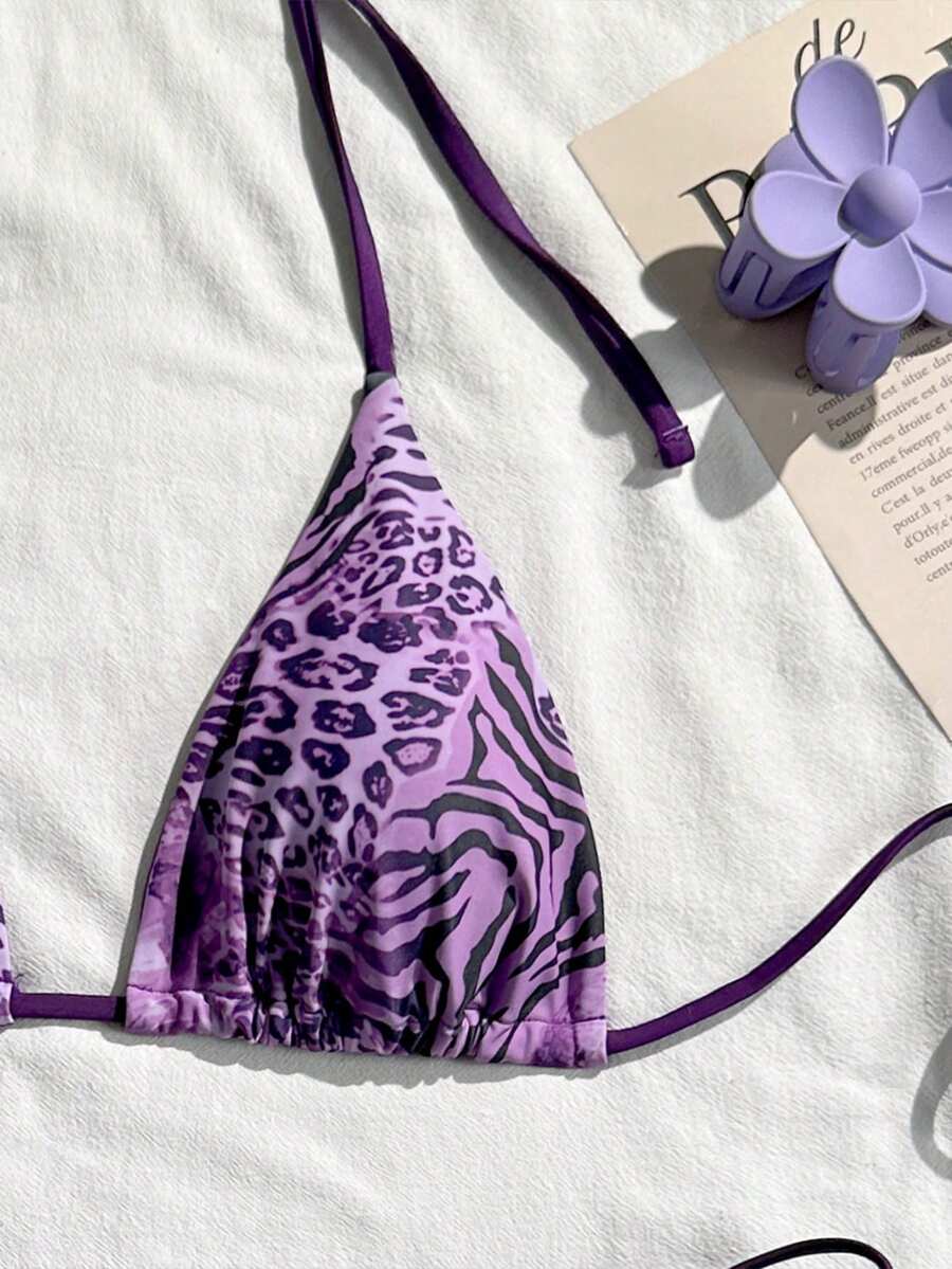 Women's vintage leopard print 2-piece bikini set featuring a high waist tie-side bottom and a halter neck triangle top.