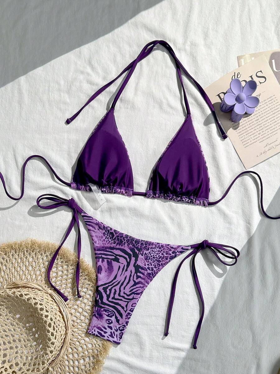 Women's vintage leopard print 2-piece bikini set featuring a high waist tie-side bottom and a halter neck triangle top.