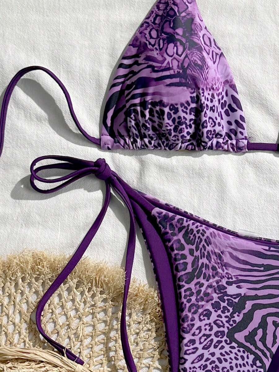 Women's vintage leopard print 2-piece bikini set featuring a high waist tie-side bottom and a halter neck triangle top.