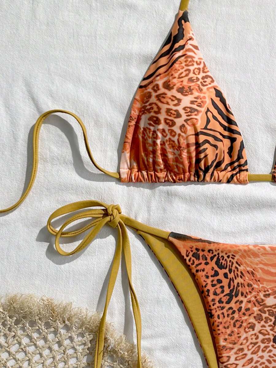 Women's vintage leopard print 2-piece bikini set featuring a high waist tie-side bottom and a halter neck triangle top.