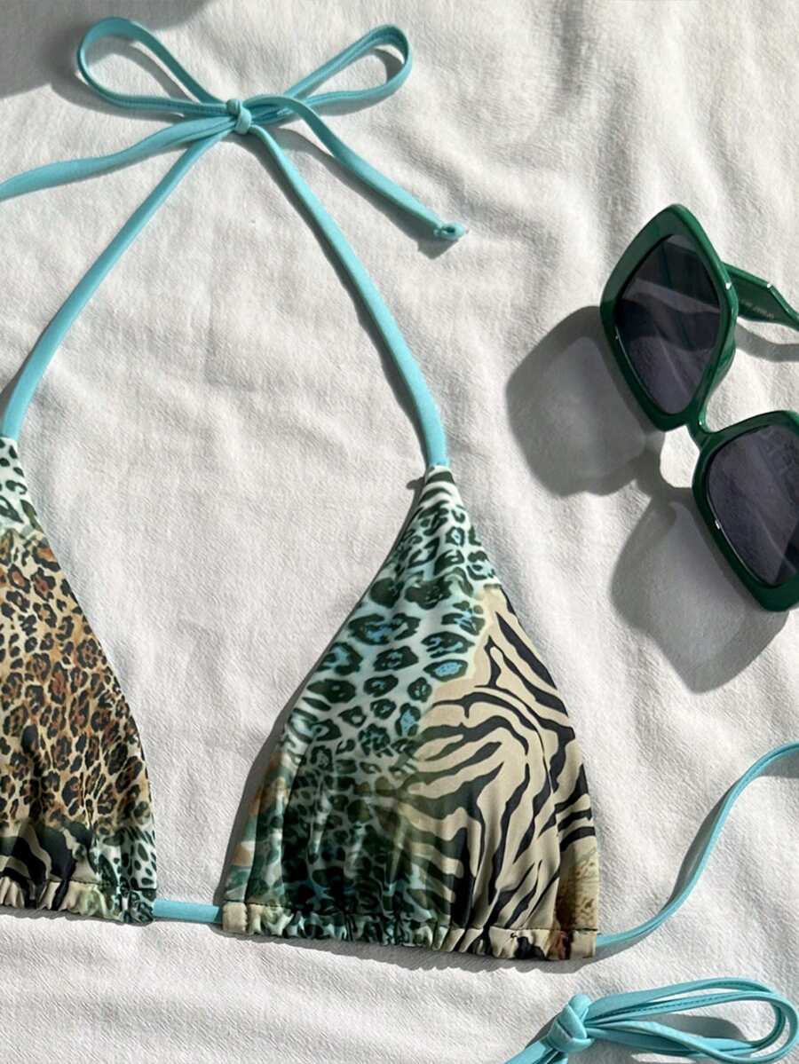 Women's vintage leopard print 2-piece bikini set featuring a high waist tie-side bottom and a halter neck triangle top.
