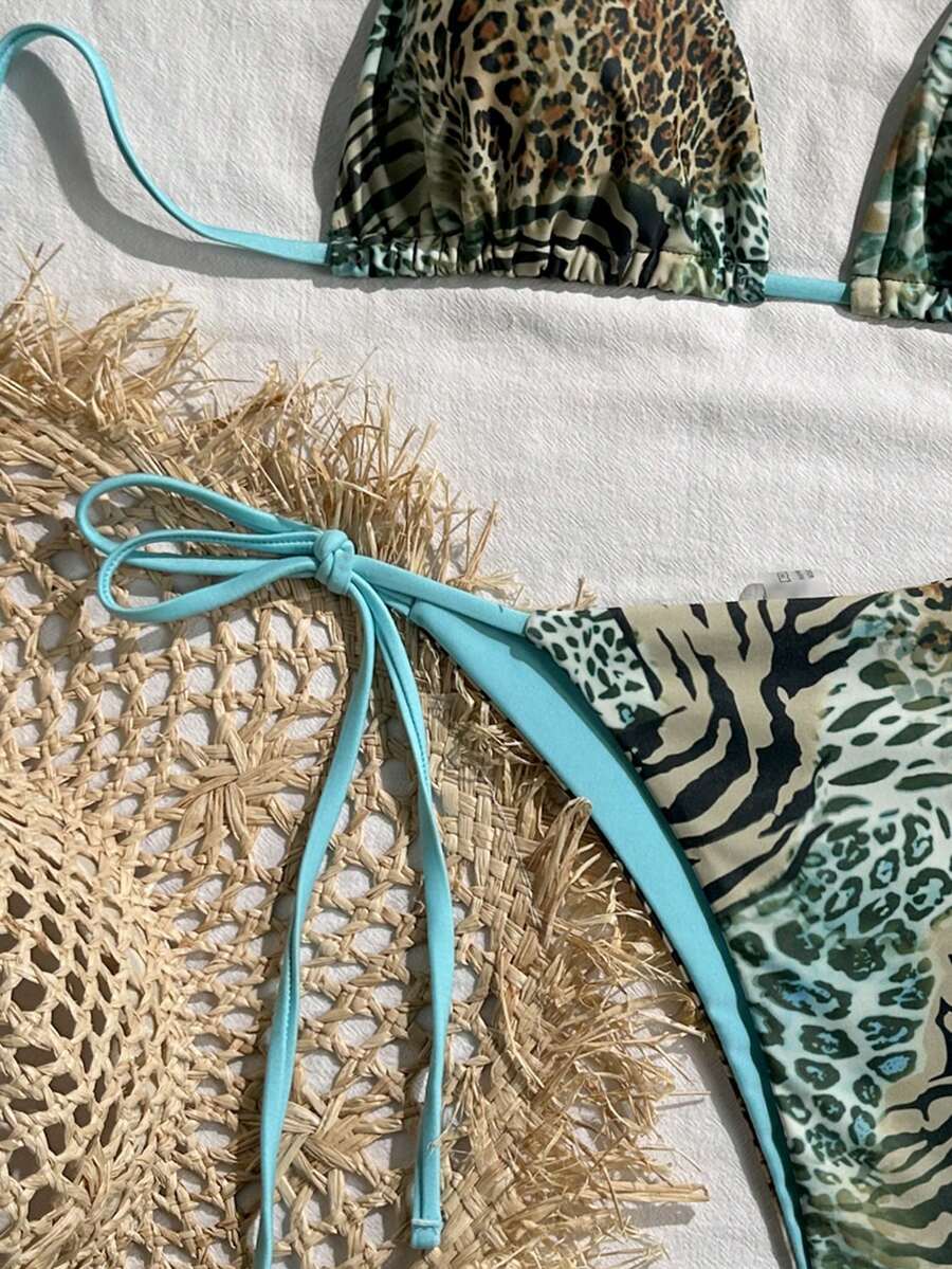 Women's vintage leopard print 2-piece bikini set featuring a high waist tie-side bottom and a halter neck triangle top.