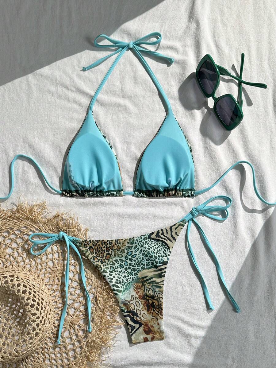 Women's vintage leopard print 2-piece bikini set featuring a high waist tie-side bottom and a halter neck triangle top.