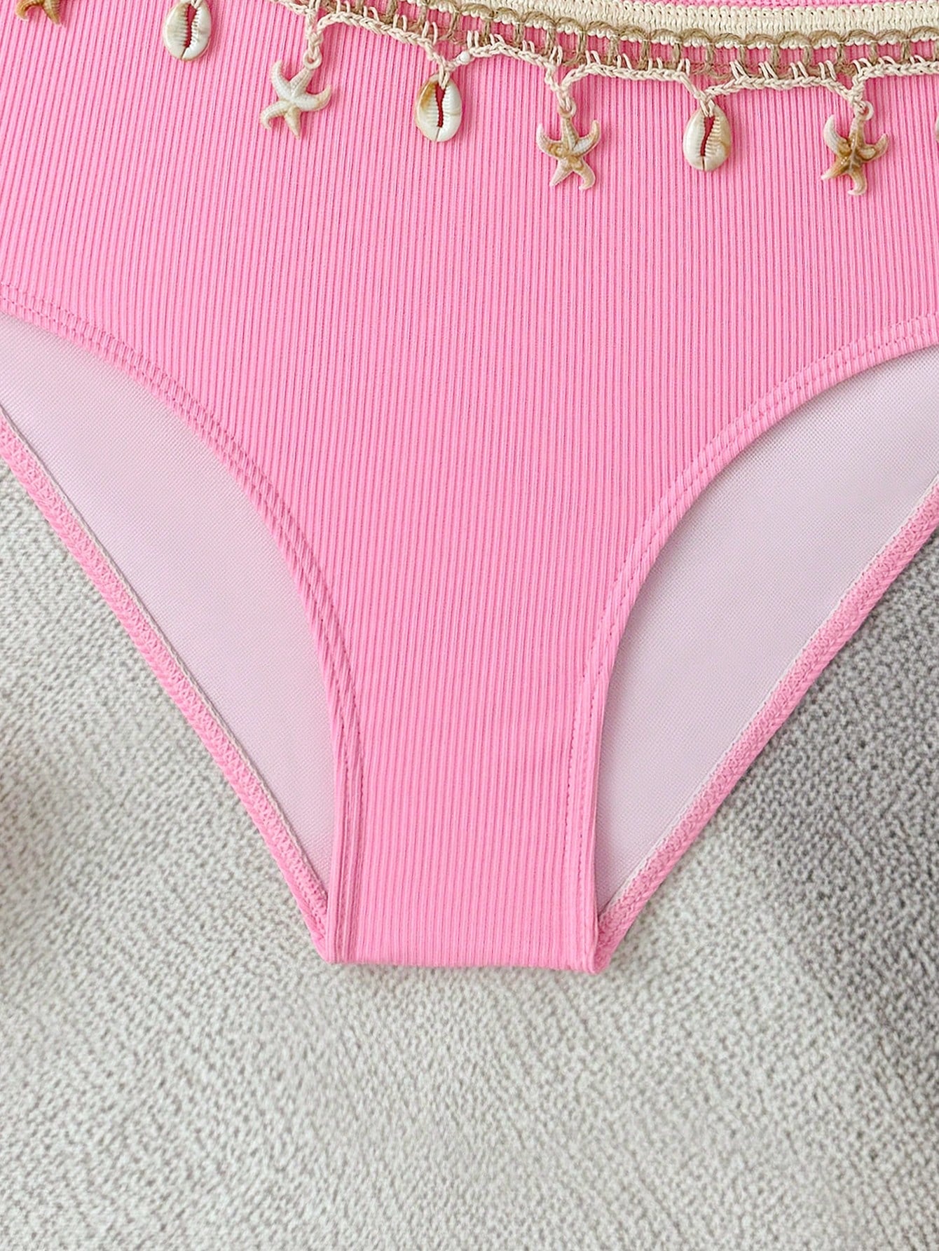 Girls black one-piece swimsuit with asymmetrical neckline, cutout waist detail, colorblock design, and medium-stretch swimsuit fabric for beach and pool wear.