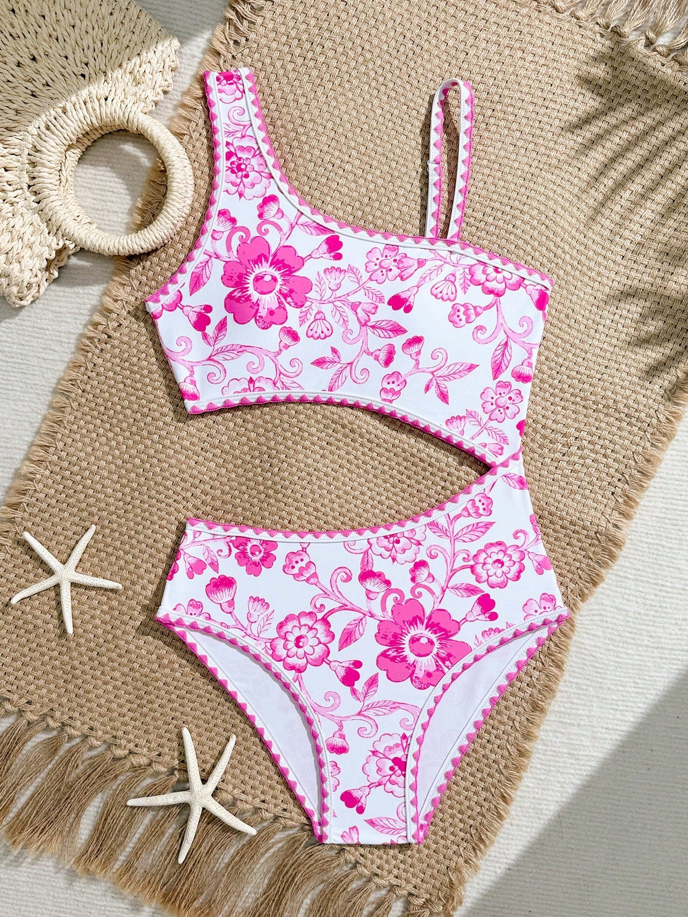 Tween girls one-piece swimsuit featuring an asymmetric neckline, pendant decor, plain design, wireless bra, high-cut bottom, and medium-stretch fabric.