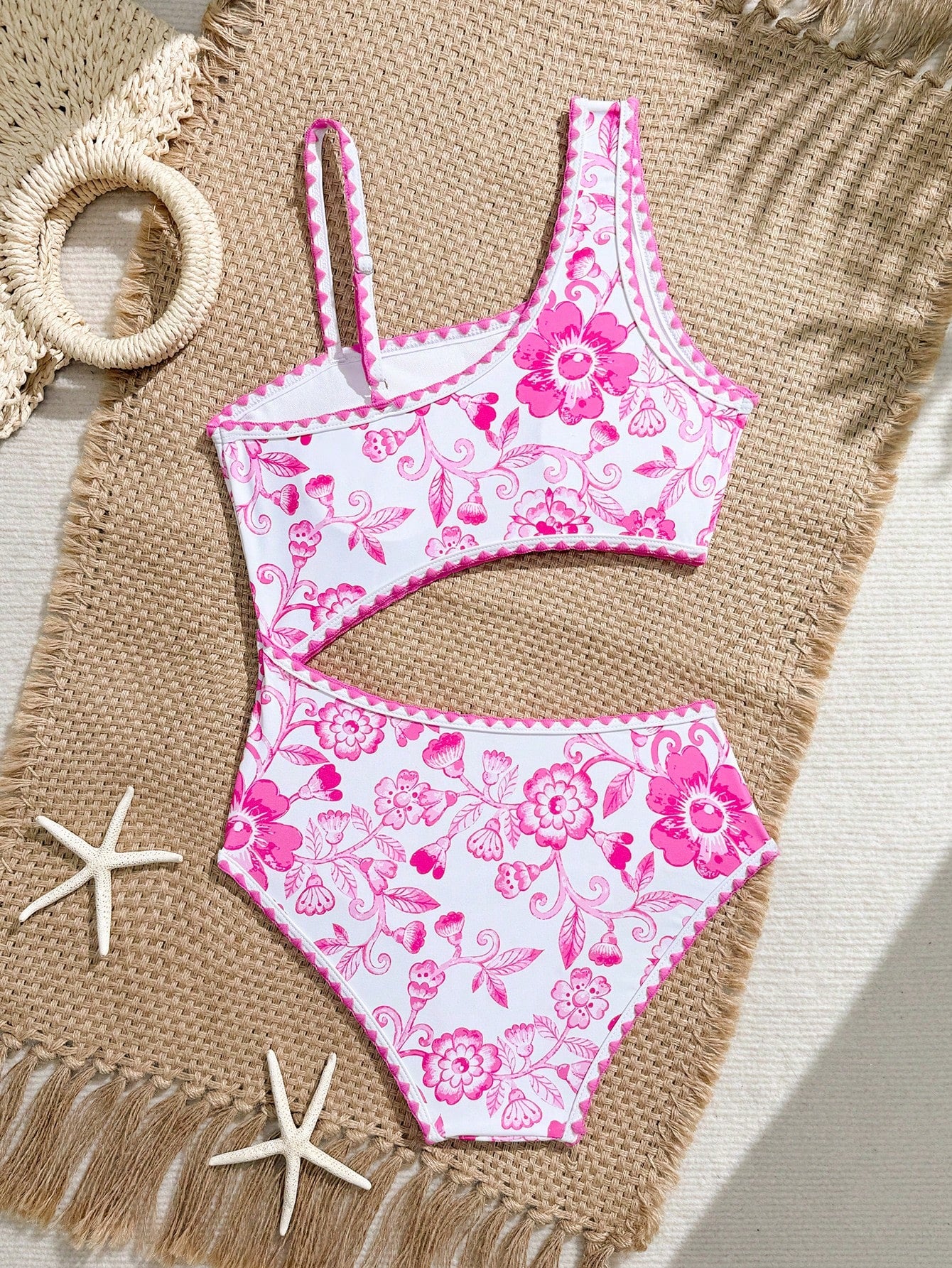Tween girls one-piece swimsuit featuring an asymmetric neckline, pendant decor, plain design, wireless bra, high-cut bottom, and medium-stretch fabric.