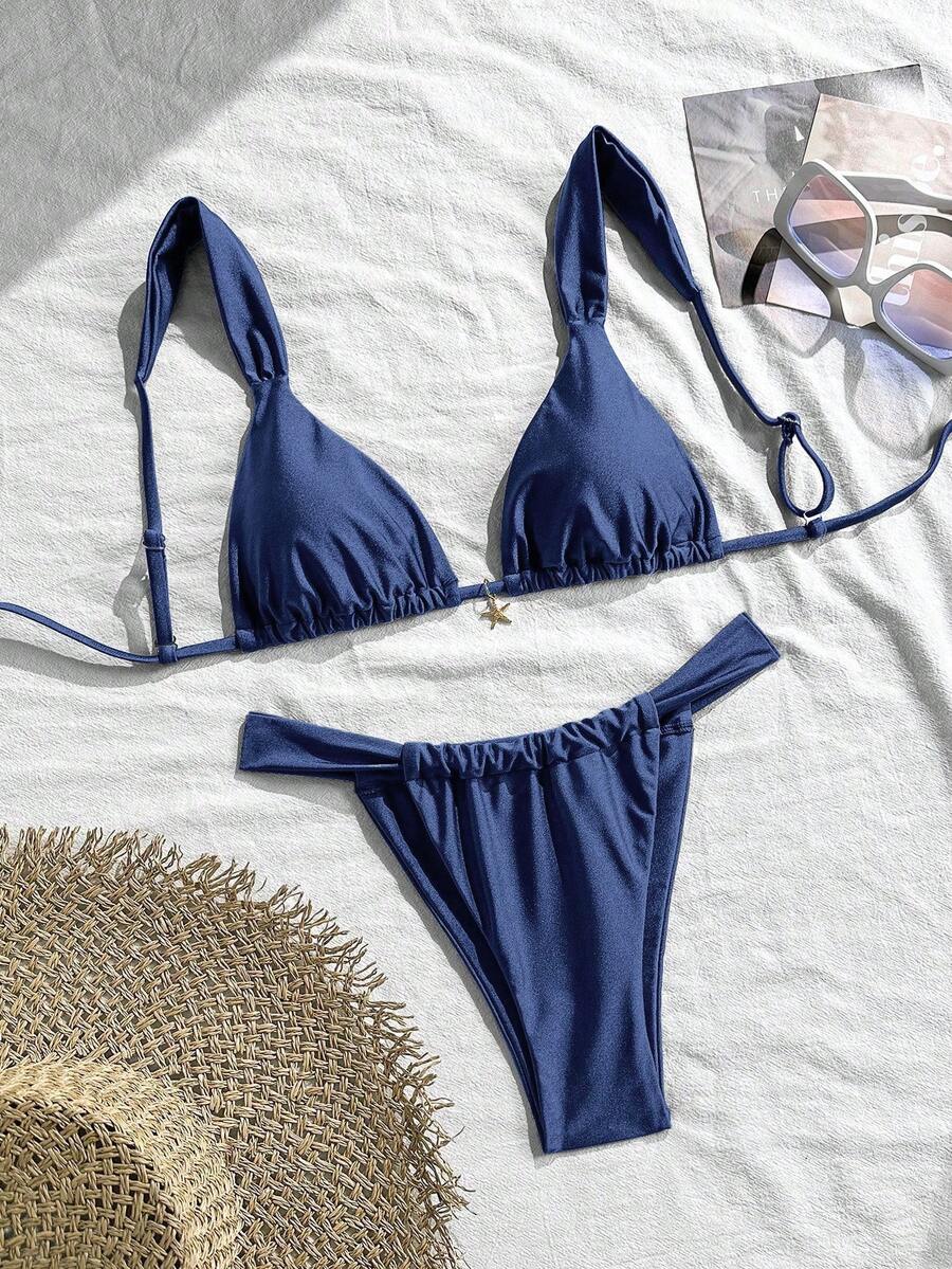 Women's 2-piece triangle cup bikini set in solid color featuring woven pearl shell decoration, halter neckline, and high-waist side-tie ruched bottoms.