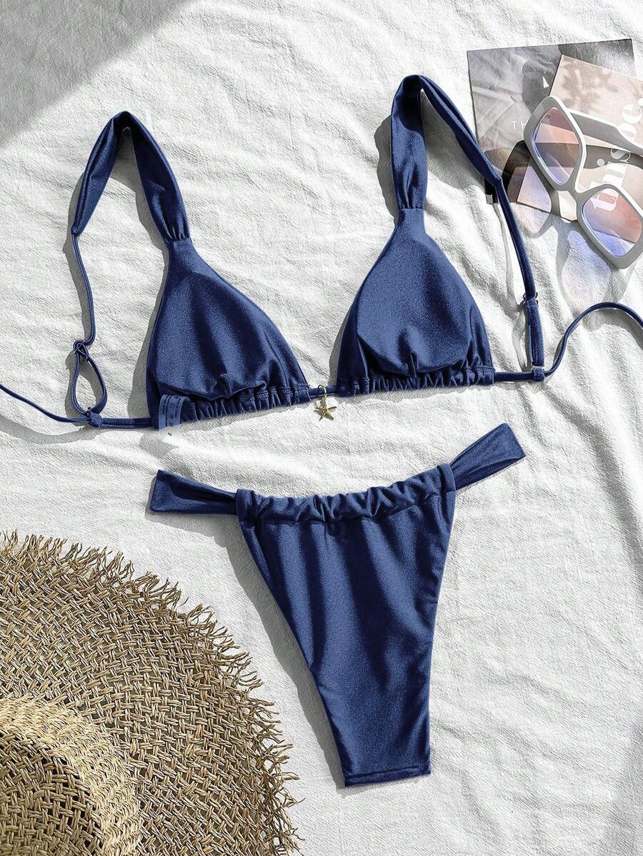 Women's 2-piece triangle cup bikini set in solid color featuring woven pearl shell decoration, halter neckline, and high-waist side-tie ruched bottoms.