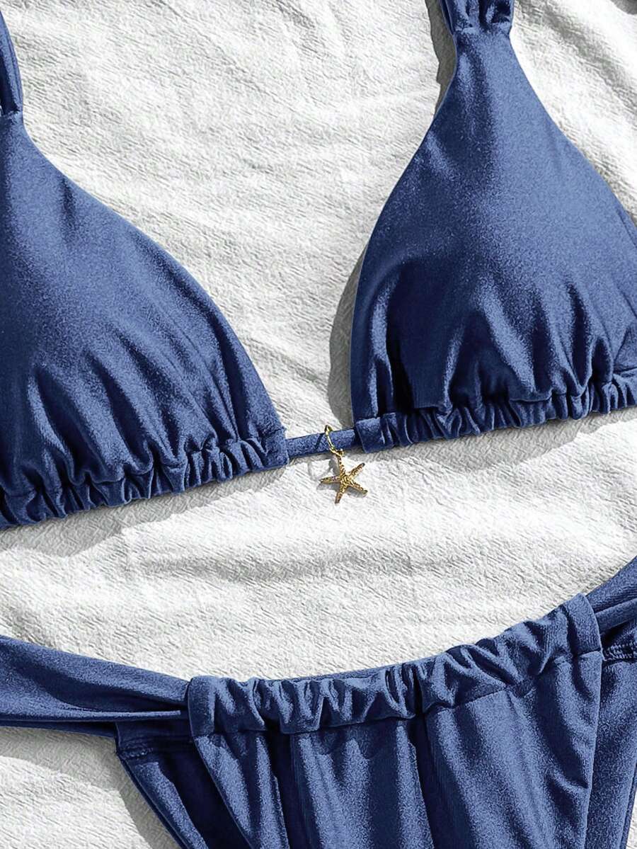 Women's 2-piece triangle cup bikini set in solid color featuring woven pearl shell decoration, halter neckline, and high-waist side-tie ruched bottoms.