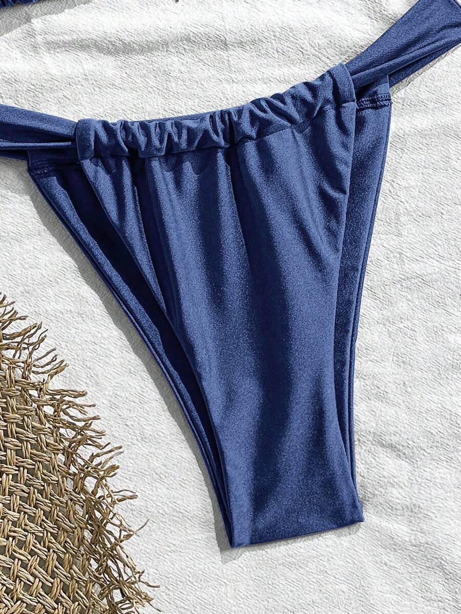 Women's 2-piece triangle cup bikini set in solid color featuring woven pearl shell decoration, halter neckline, and high-waist side-tie ruched bottoms.
