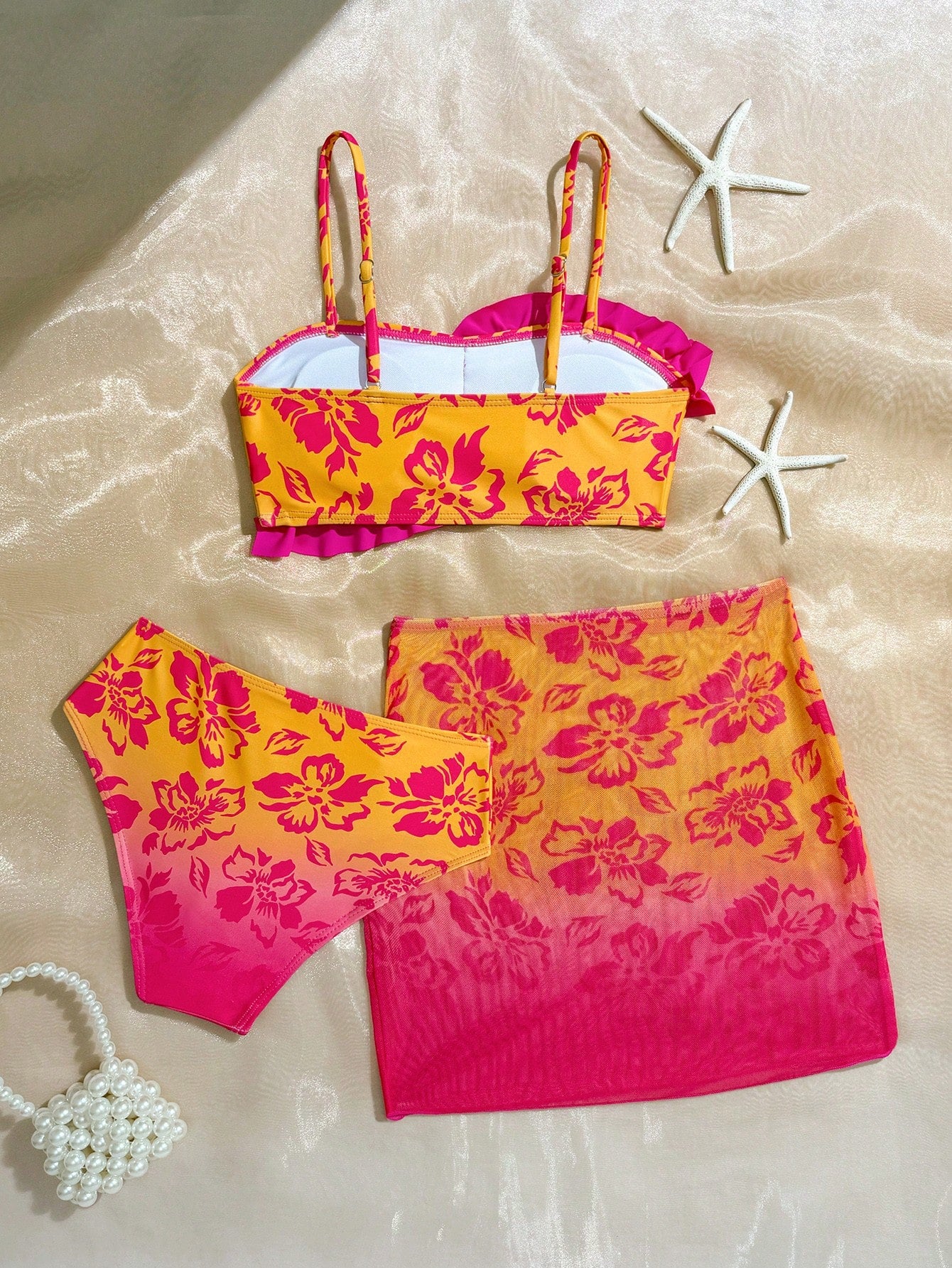 Tween girls bikini set with shell and starfish woven band details, spaghetti strap sleeveless top, and mid-waist skirt-style bottom in blue.